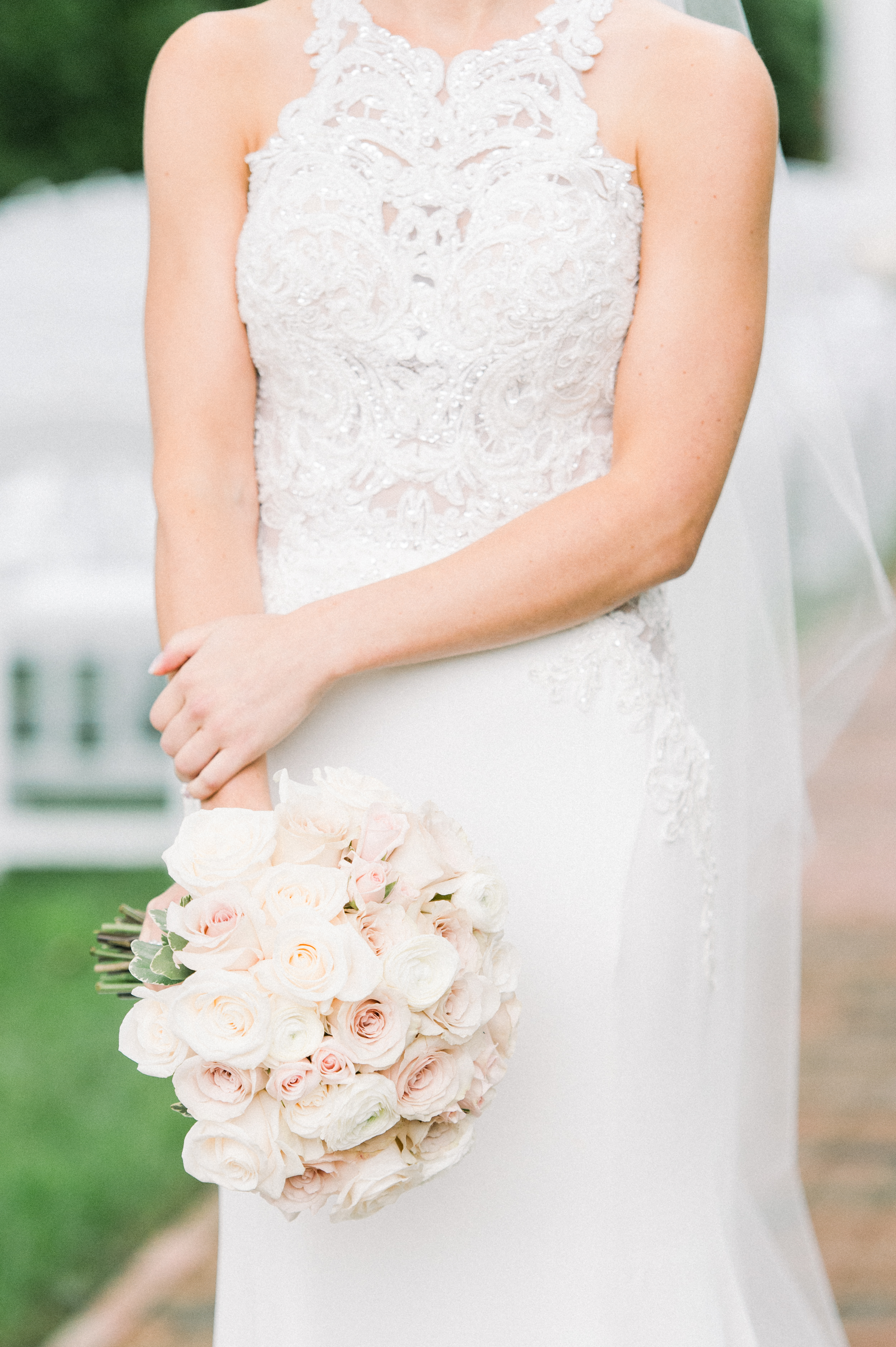 blush bouquet and lace dress details at a wedding at the commons 1854