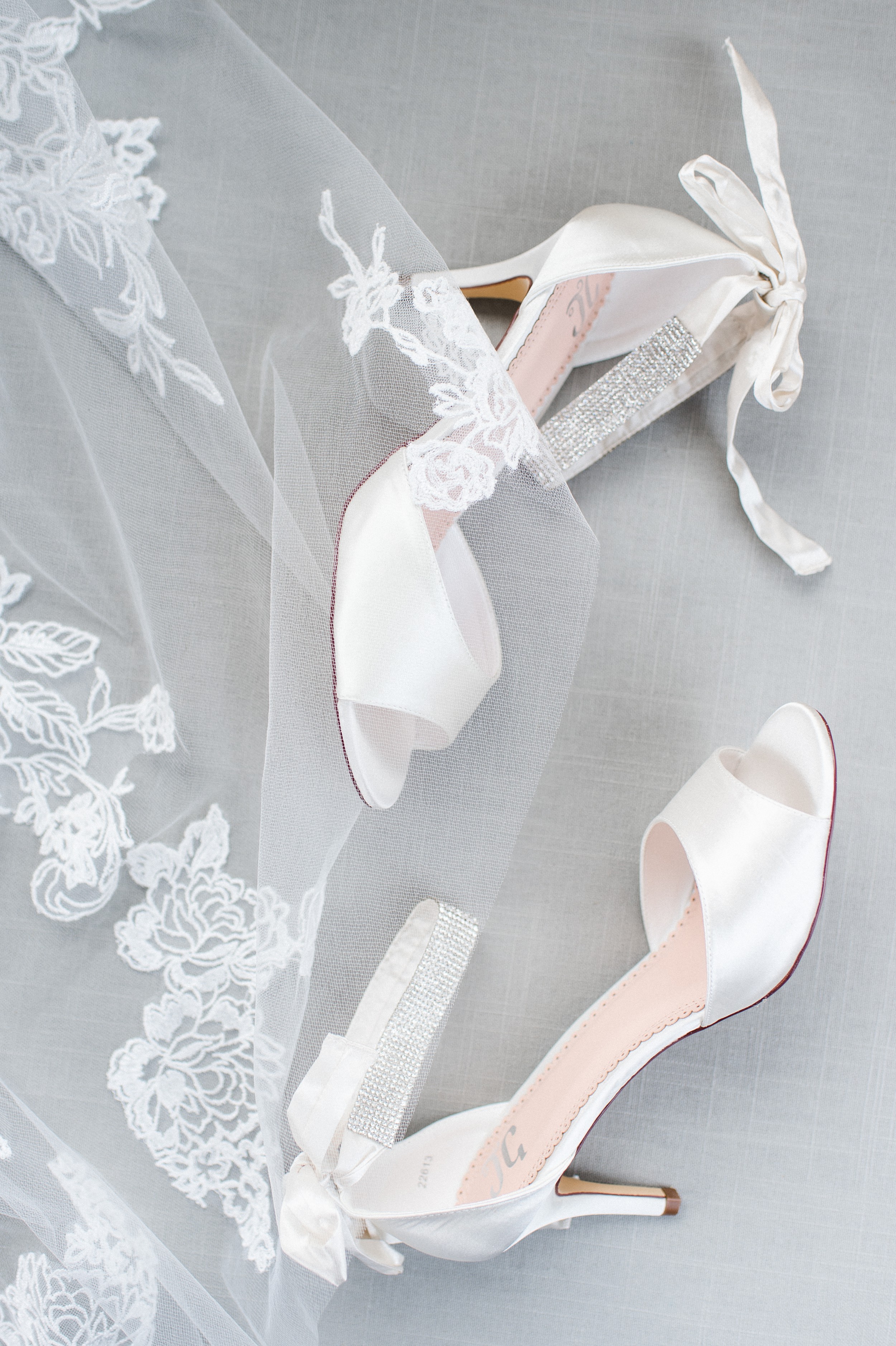 The Villa at Ridder Country Club Spring Wedding | styled bridal flat lay of veil and shoes