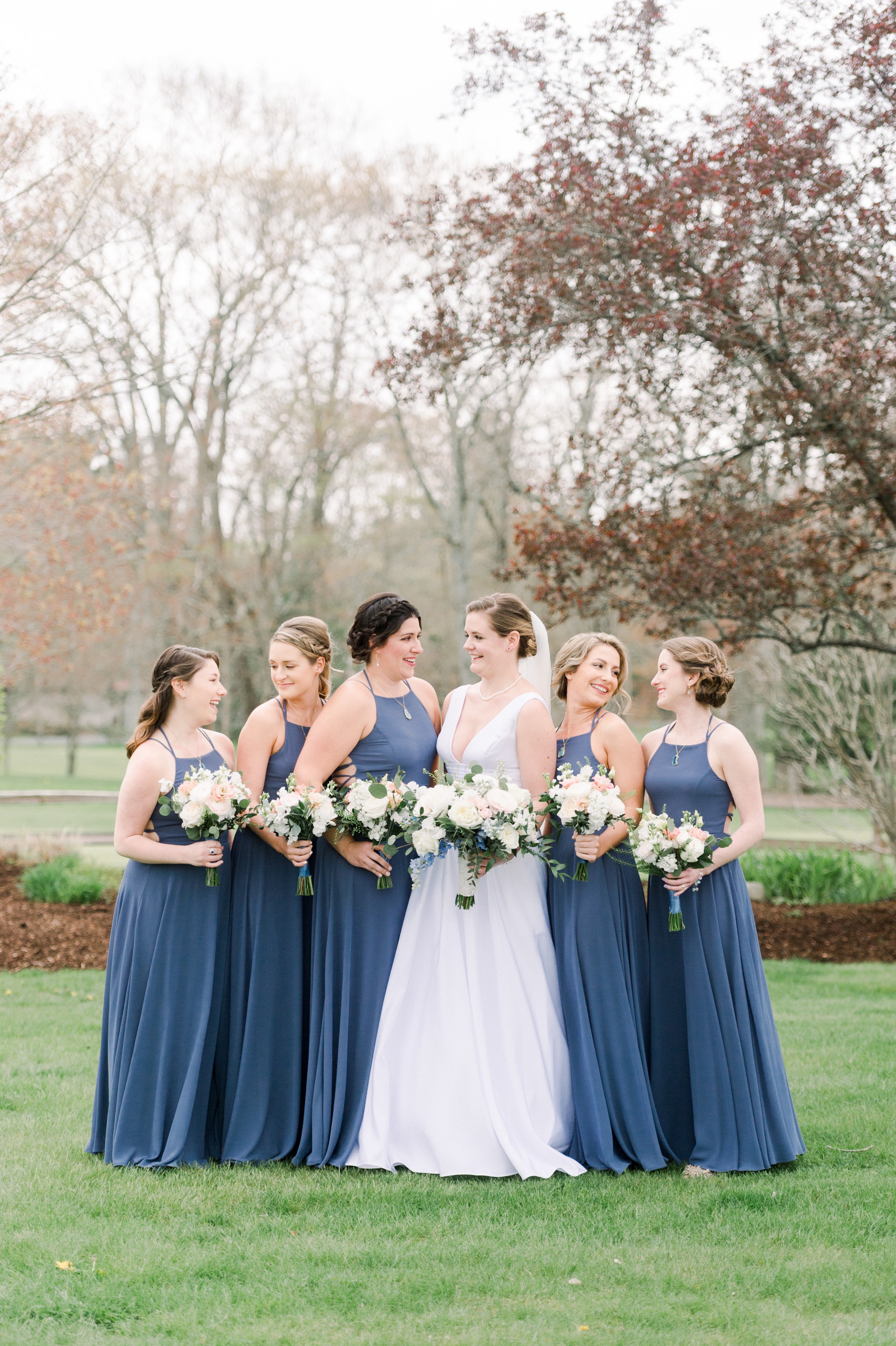 The Villa at Ridder Country Club Spring Wedding | bridal party portrait of bridesmaids in dusty blue dresses