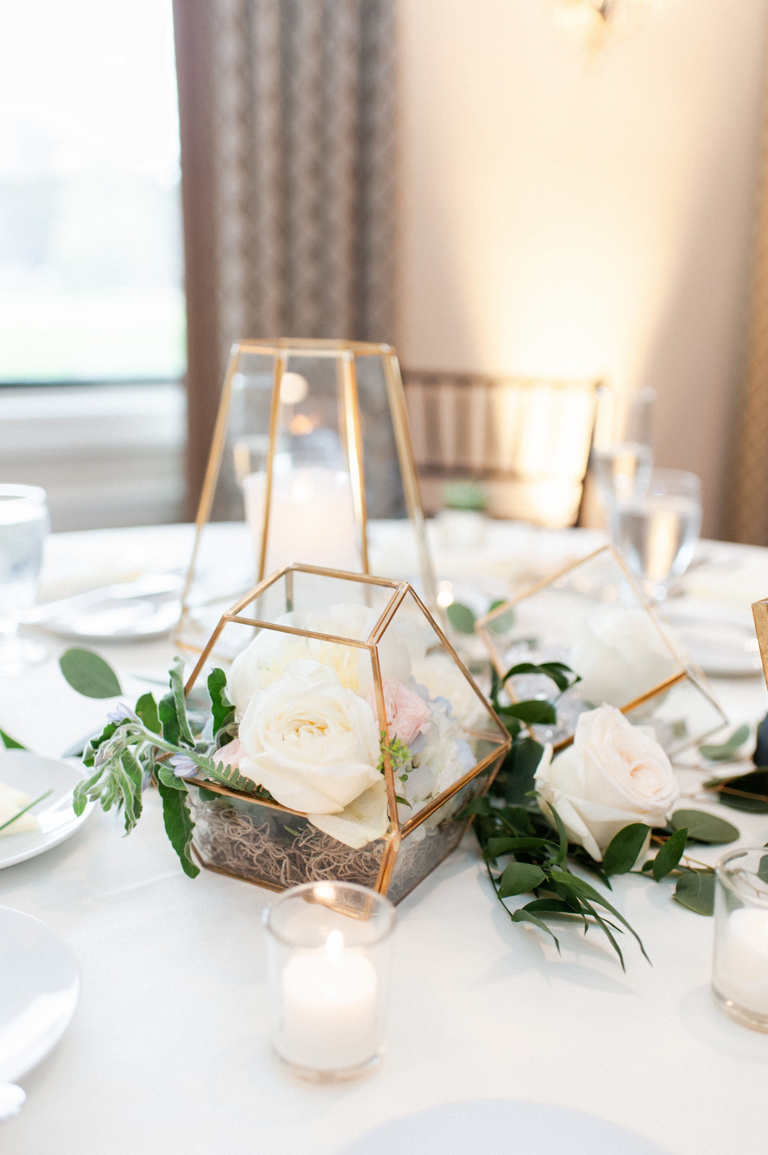 The Villa at Ridder Country Club Spring Wedding | geometric glass centerpieces with flowers | reception inspiration