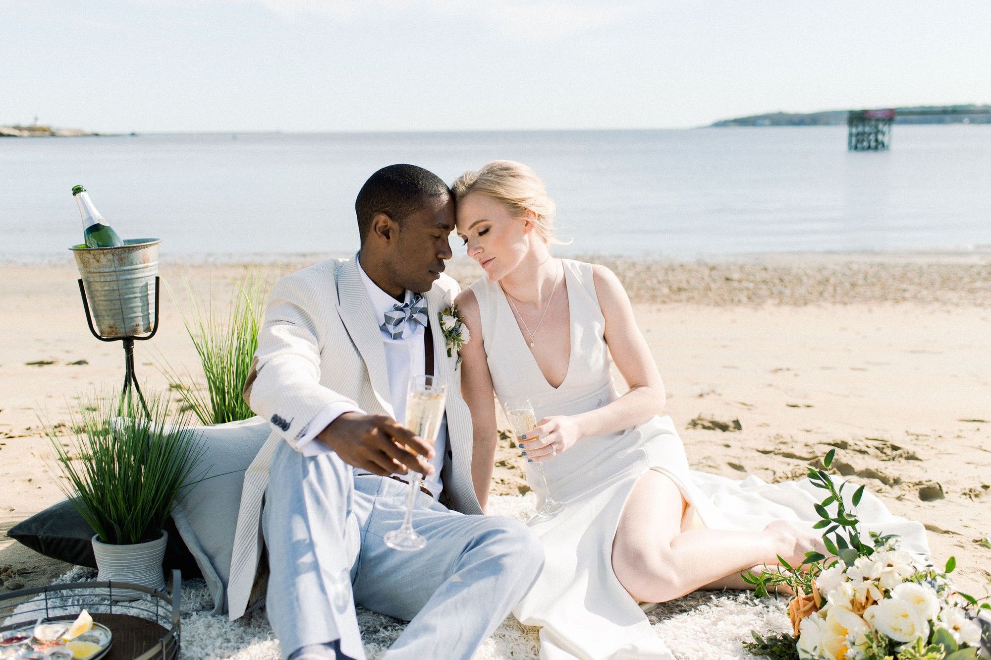 Gloucester MA Beauport Hotel Wedding | Tuscan meets modern | bride and groom have champagne and oysters on beach boho lounge area