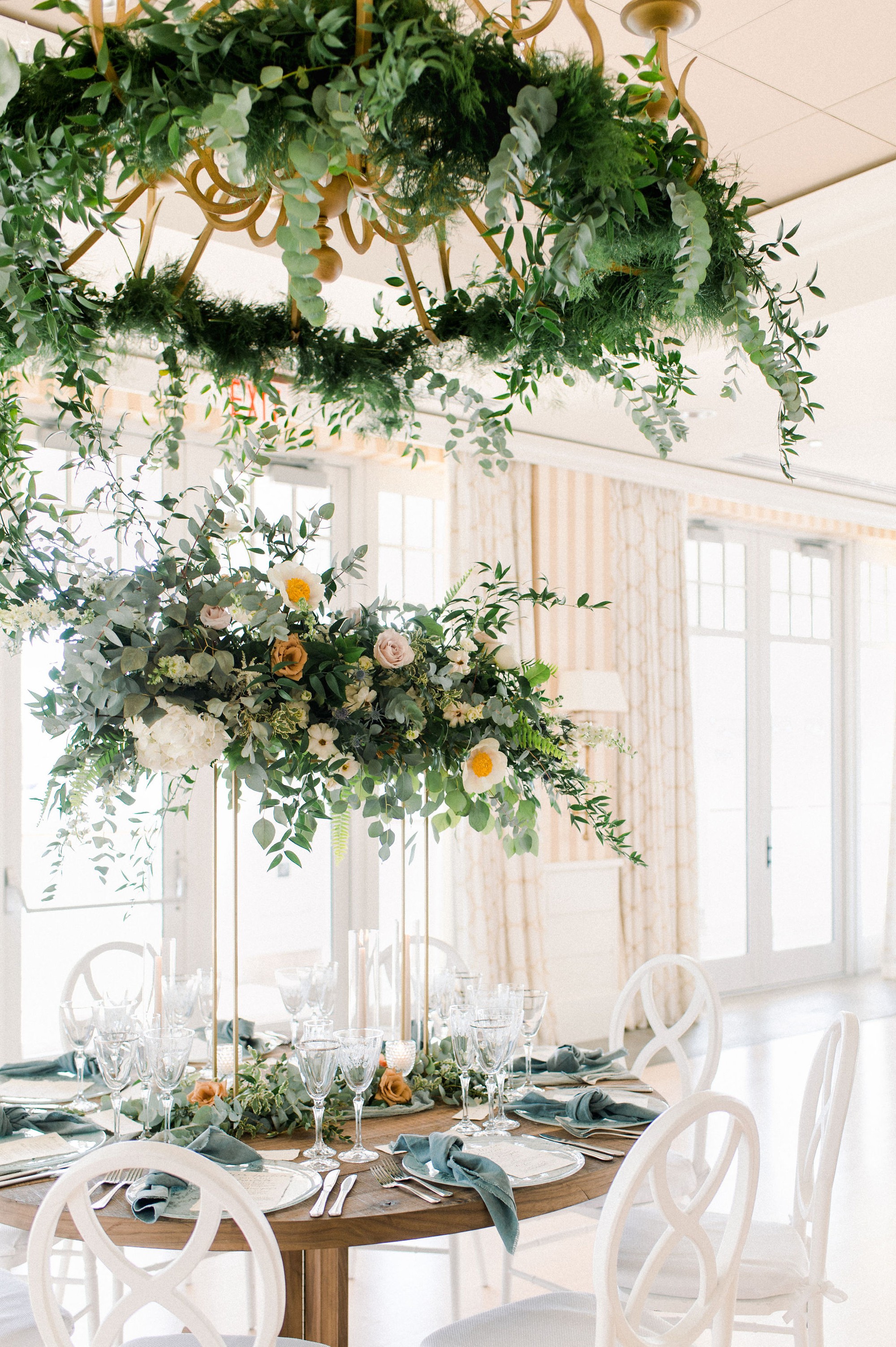 Gloucester MA Beauport Hotel Wedding | Tuscan meets modern | Party Rental LTD white chairs, round farm table, glass marble charger, glassware, and cloth napkins | hand lettered calligraphy wedding menus | modern hanging reception flowers by Lilac & Lily