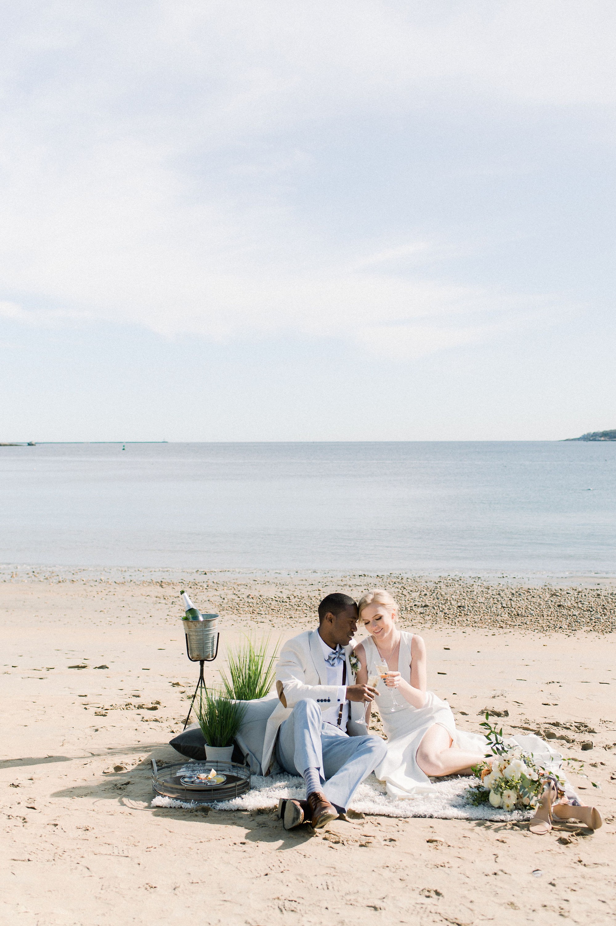 Gloucester MA Beauport Hotel Wedding | Tuscan meets modern | bride and groom have champagne and oysters on beach boho lounge area