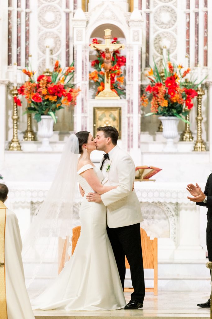 Boston wedding ceremony at Boston's Basilica bride and groom first kiss