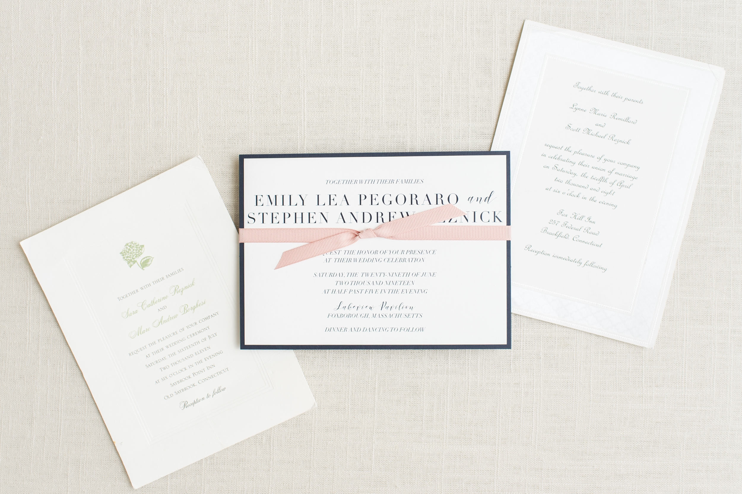Three siblings wedding invitations styled side by side on the youngest brother's wedding day