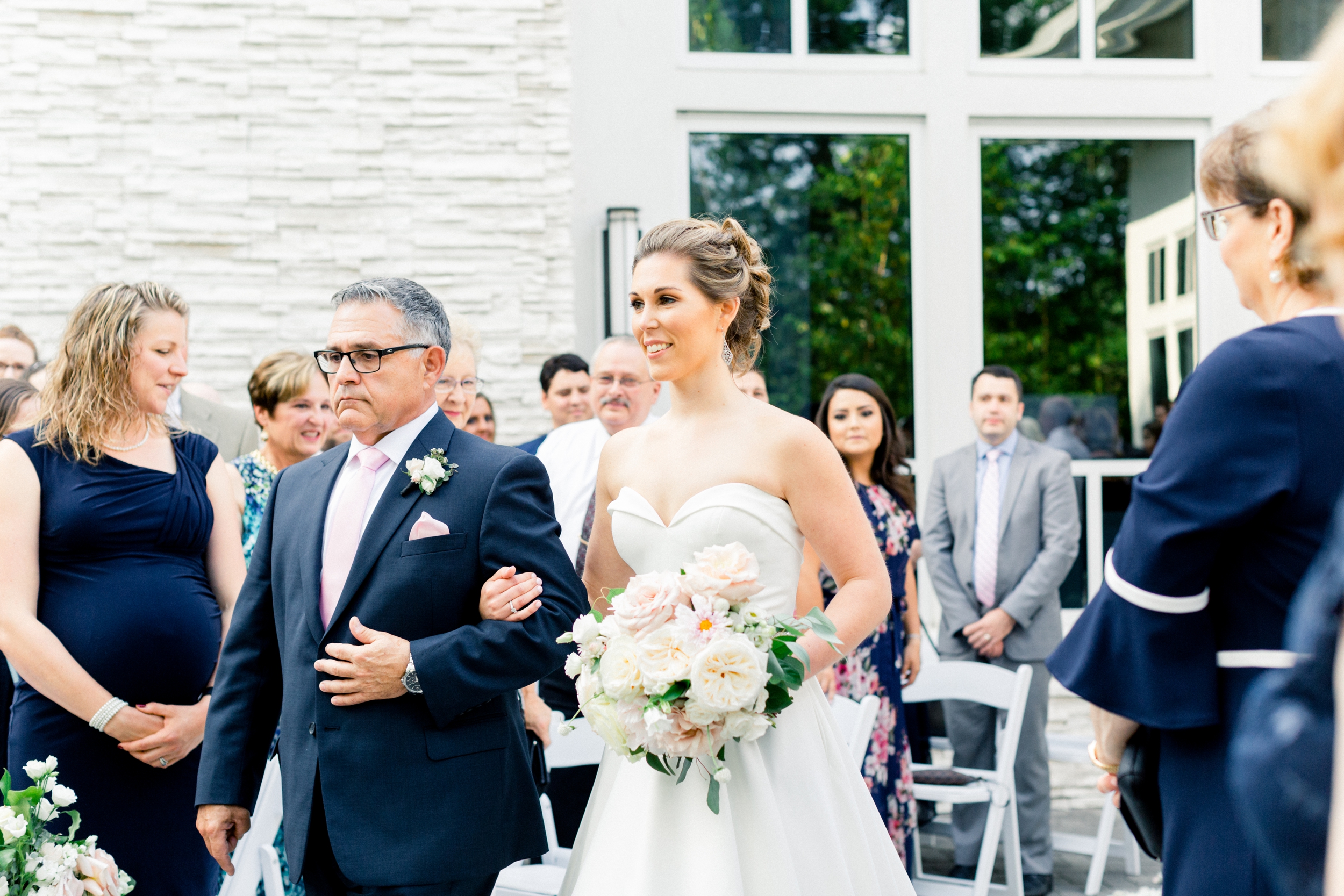 outdoor ceremony at Lakeview Pavilion father escorts daughter down the aisle