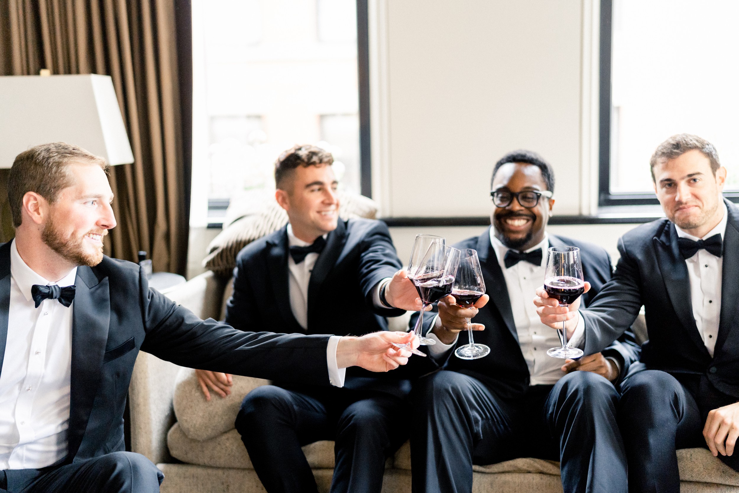 groom and groomsmen toast before Harvard Art museum wedding
