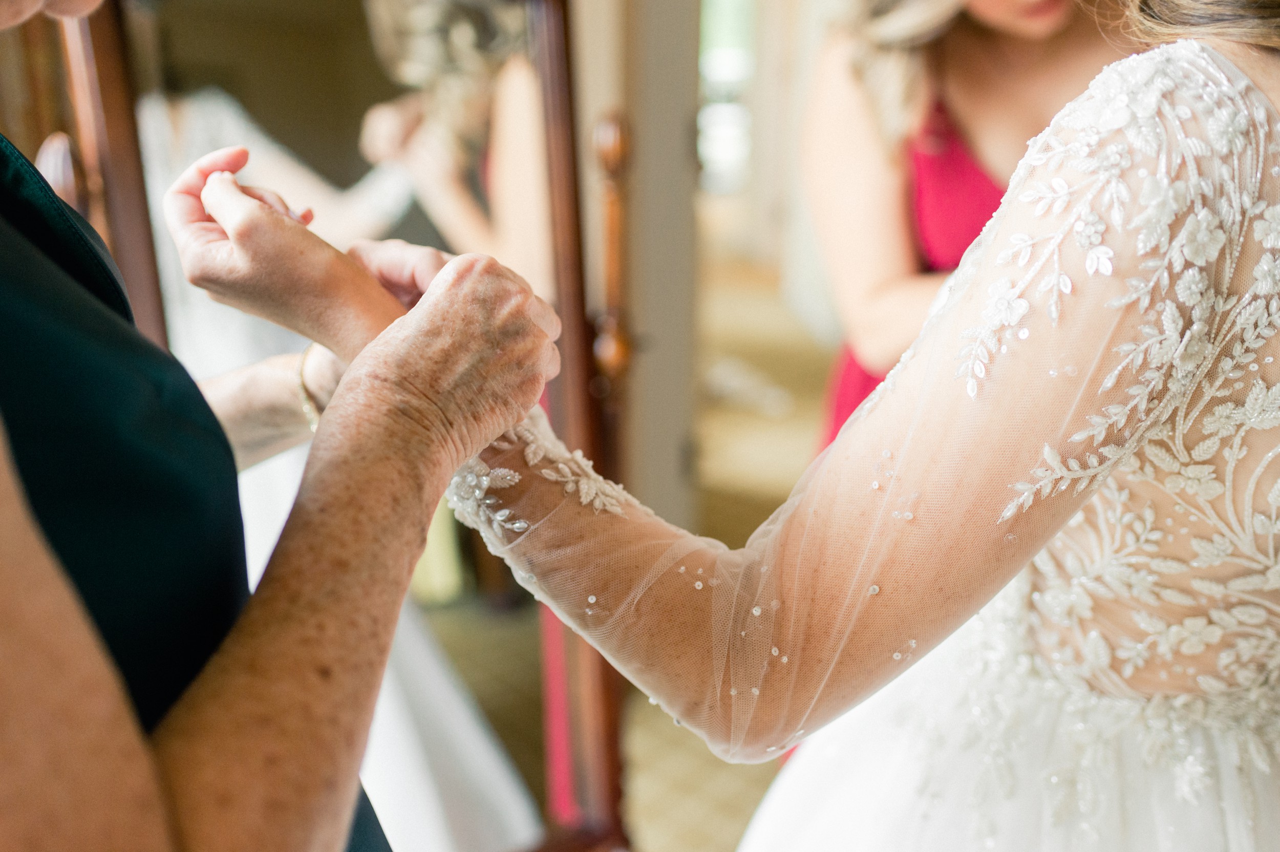 bride gets into custom enaura bridal gown