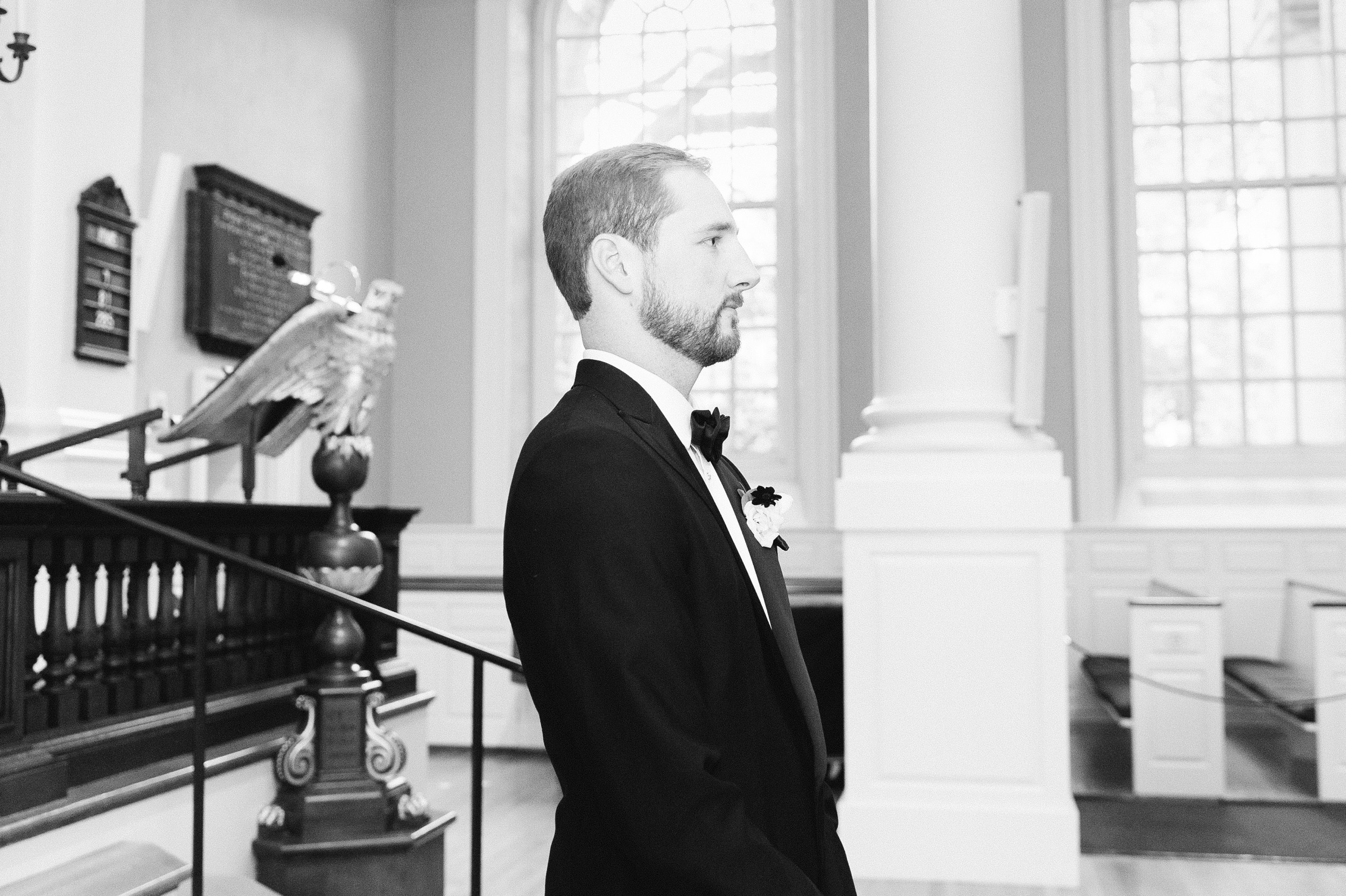 groom at Harvard Memorial Church Wedding black and white photo