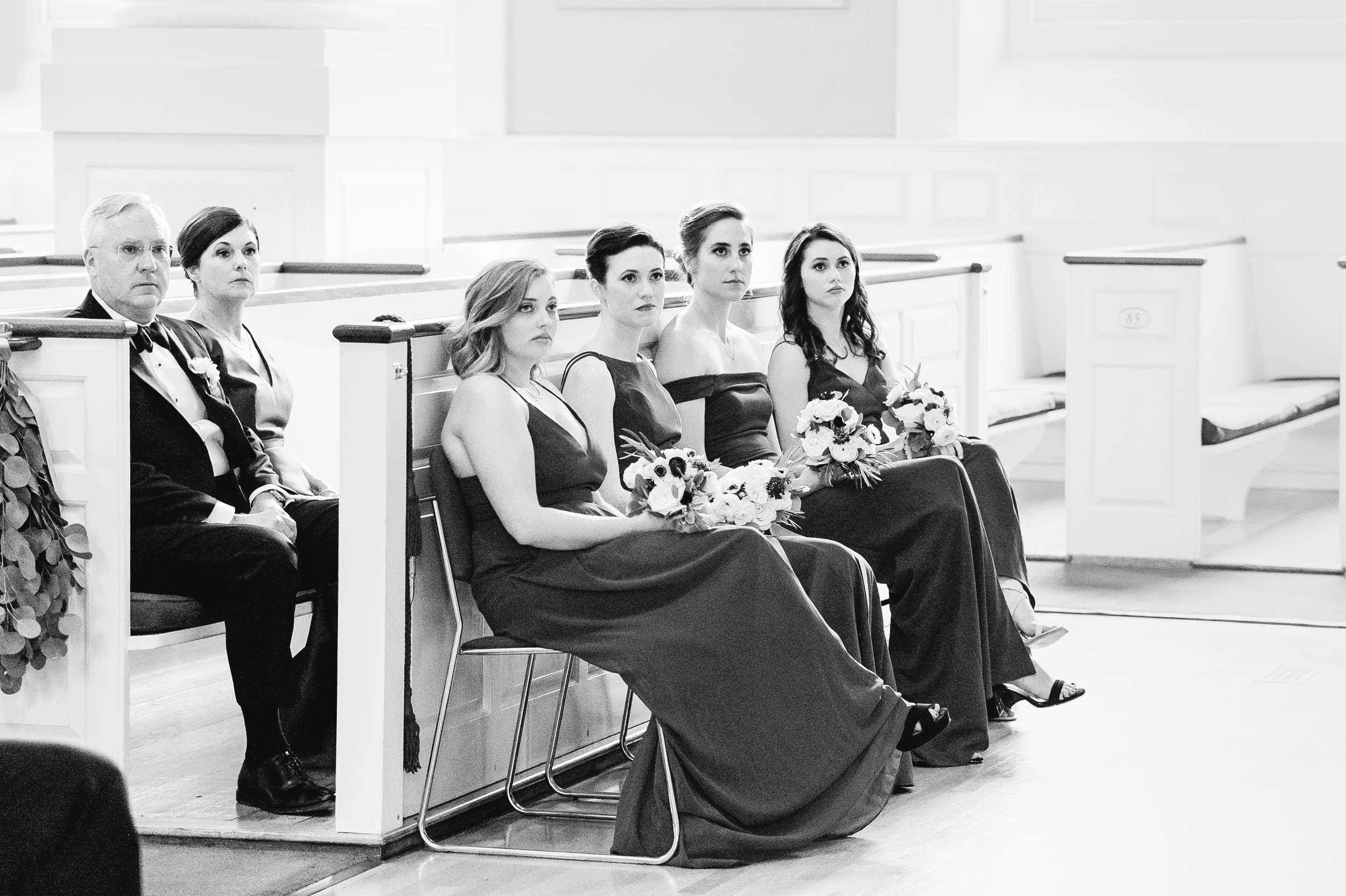 loved ones look on at Harvard Memorial Church Wedding black and white photo