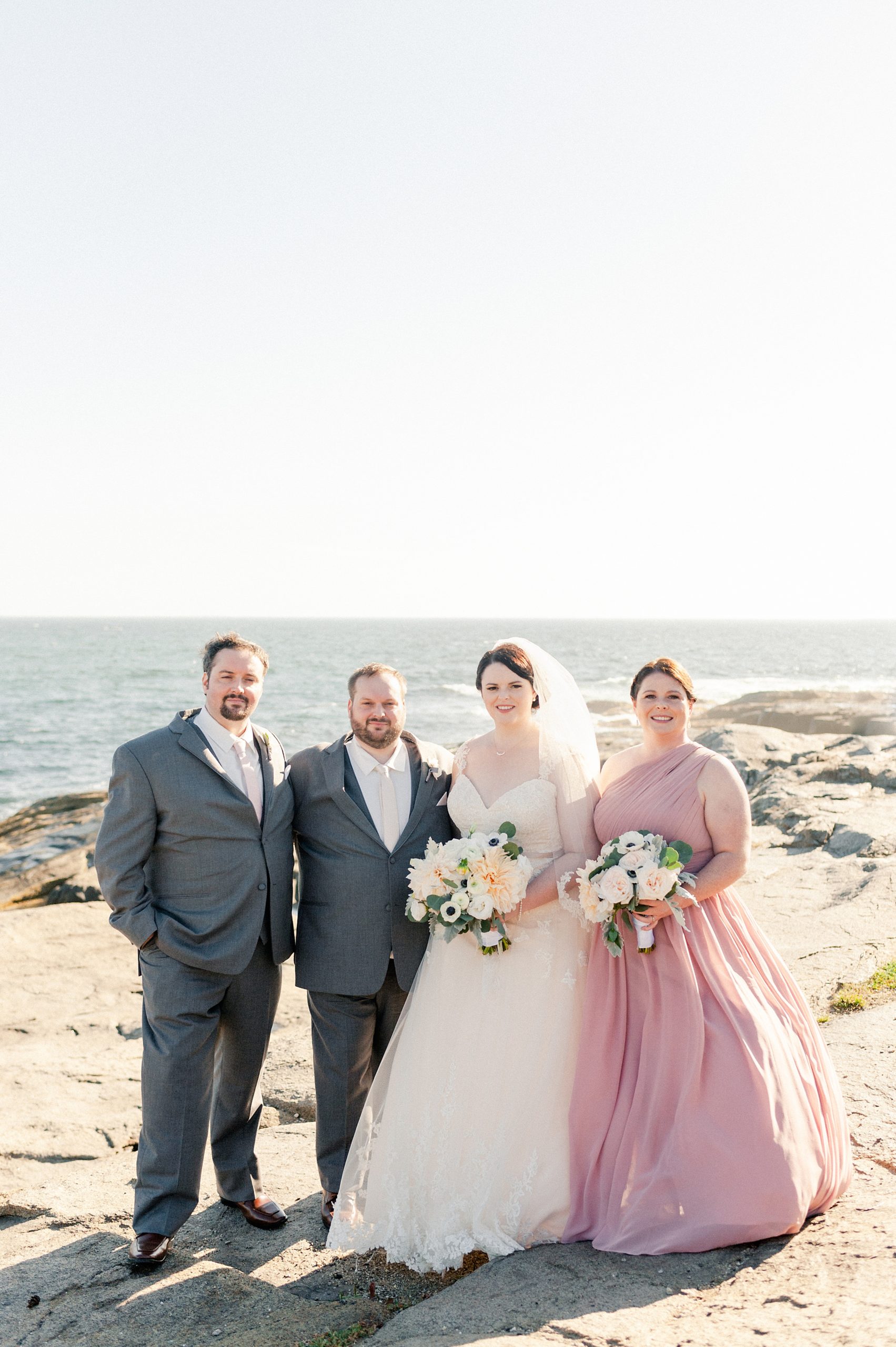 wedding party portraits at nubble lighthouse in york harbor maine