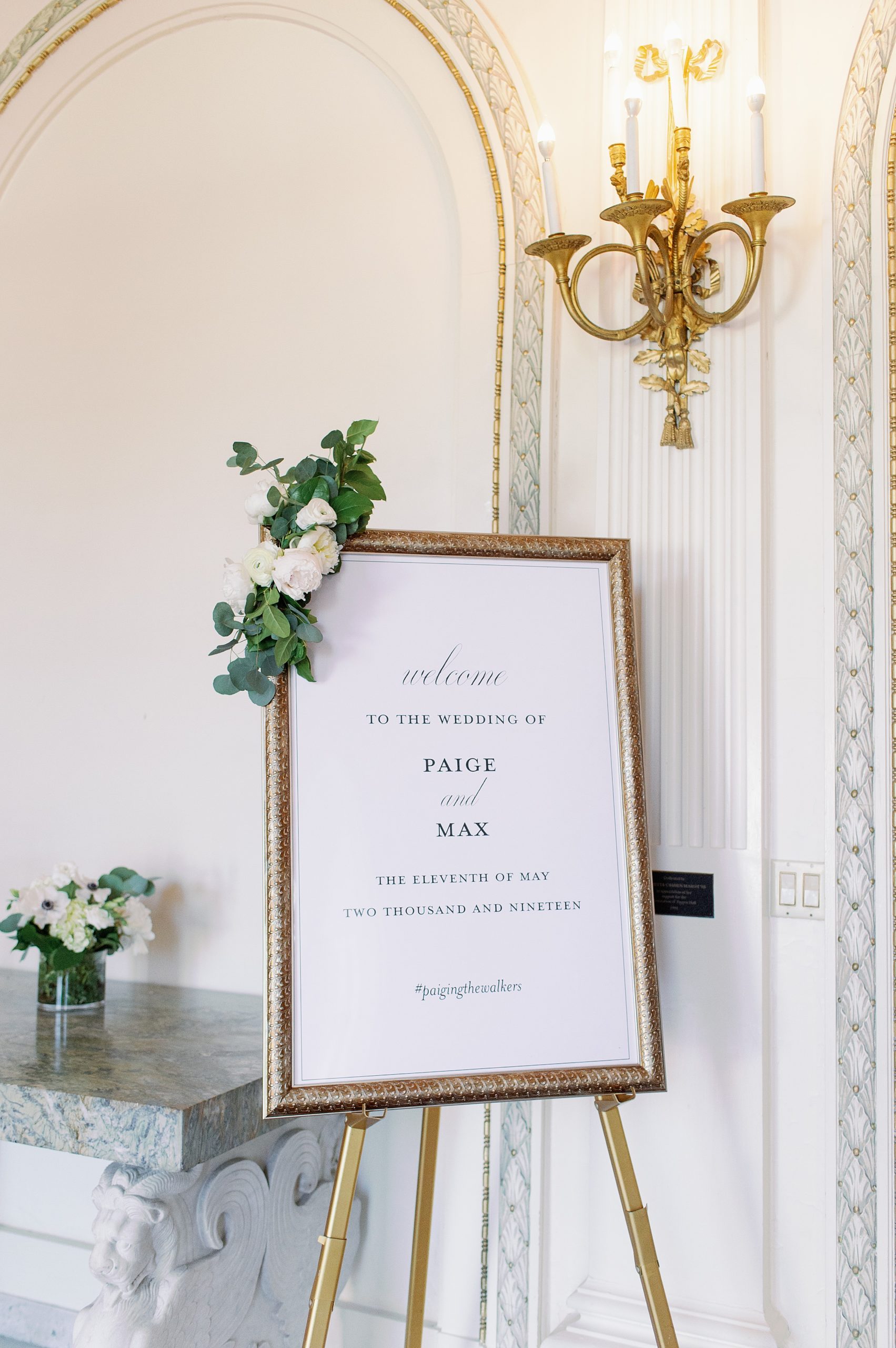 gold framed welcome sign for wedding reception