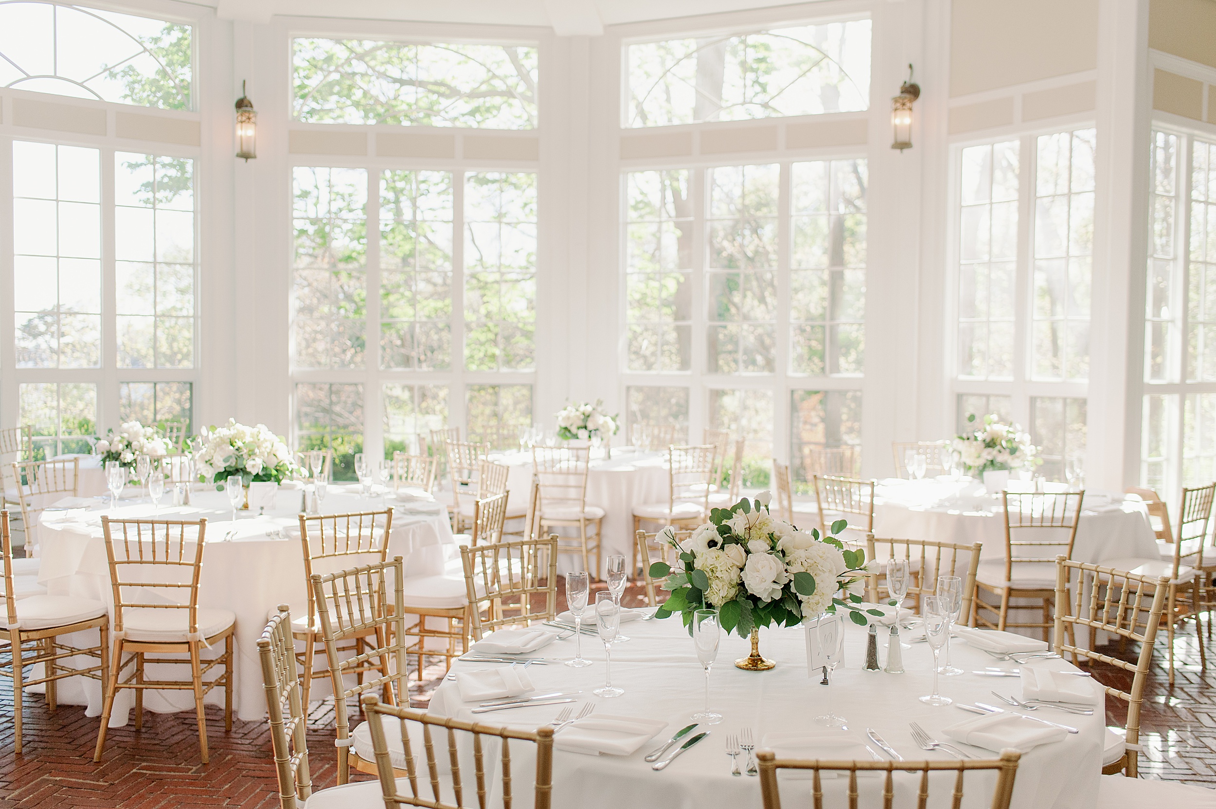 reception centerpieces white flowers and greenery