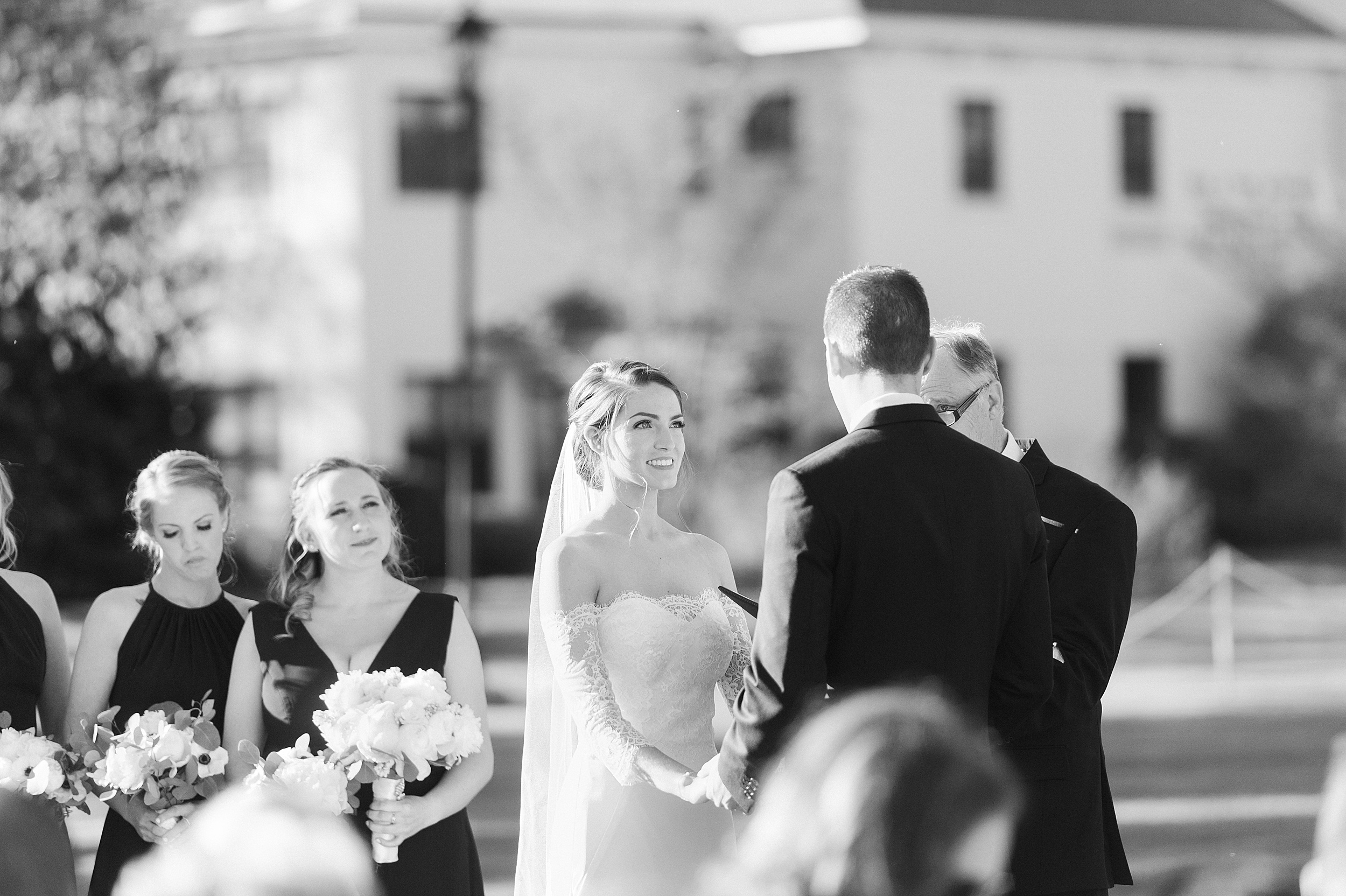 Black and white of bride and groom at Beverly MA wedding ceremony