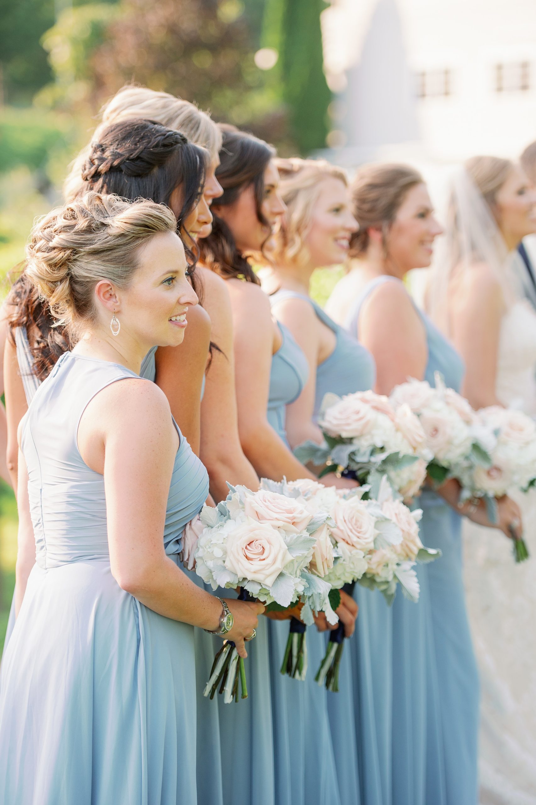 bridesmaids in pale blue dresses for vineyard wedding