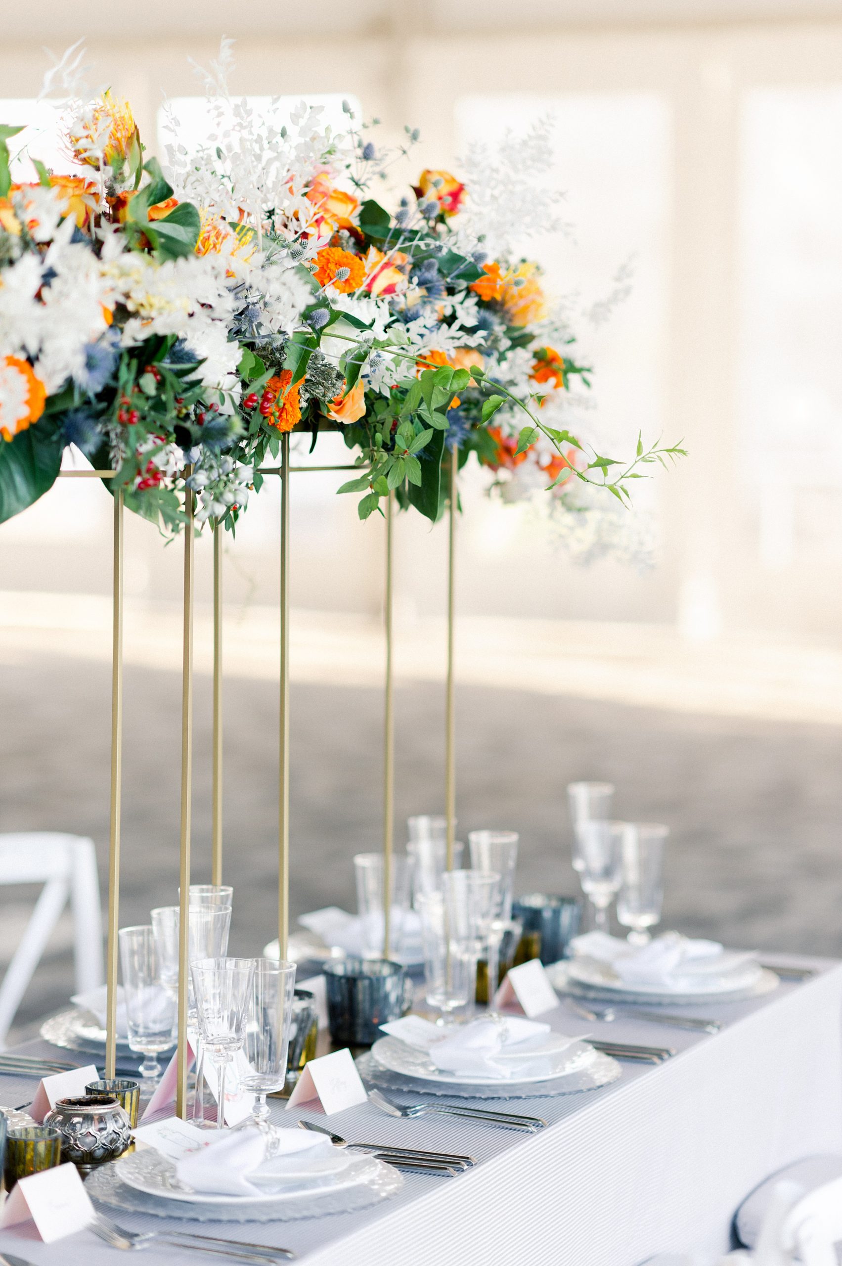 seaside wedding inspiration tablescape with pops of coral in Boston at the New England Aquarium