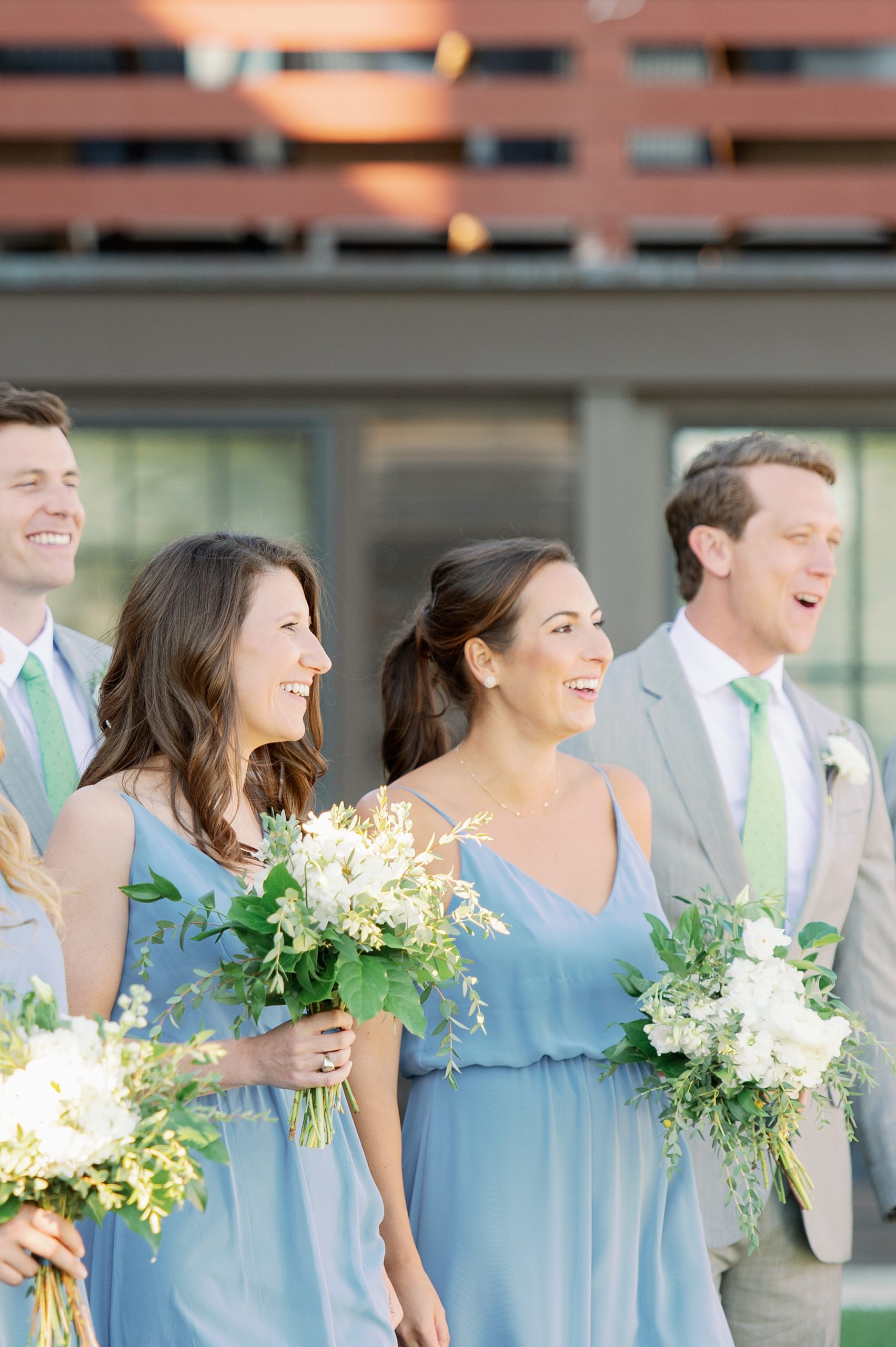 wedding party portraits in pale blue dresses and gray suits