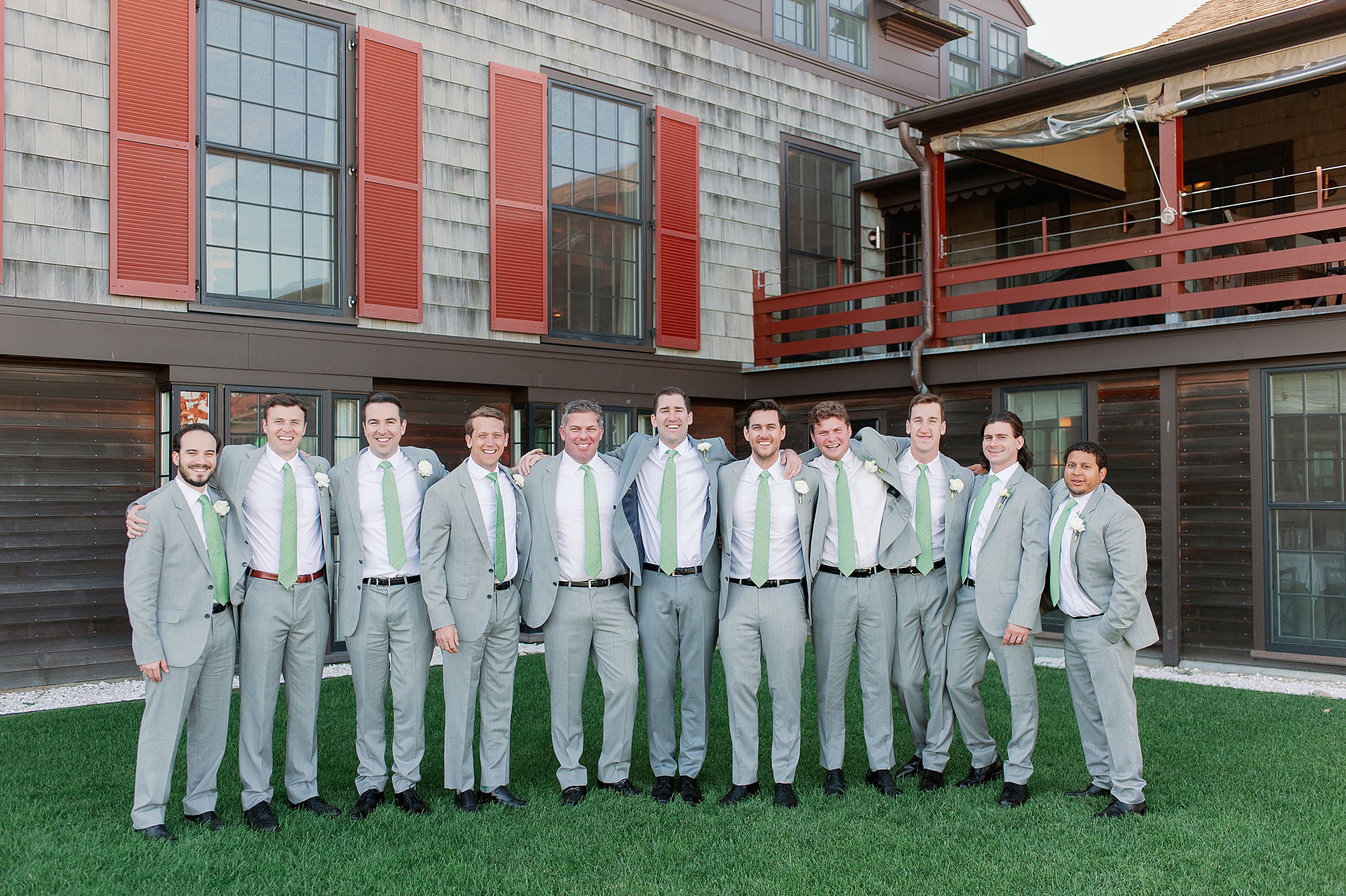 Groom and groomsmen in gray suits and preppy green ties
