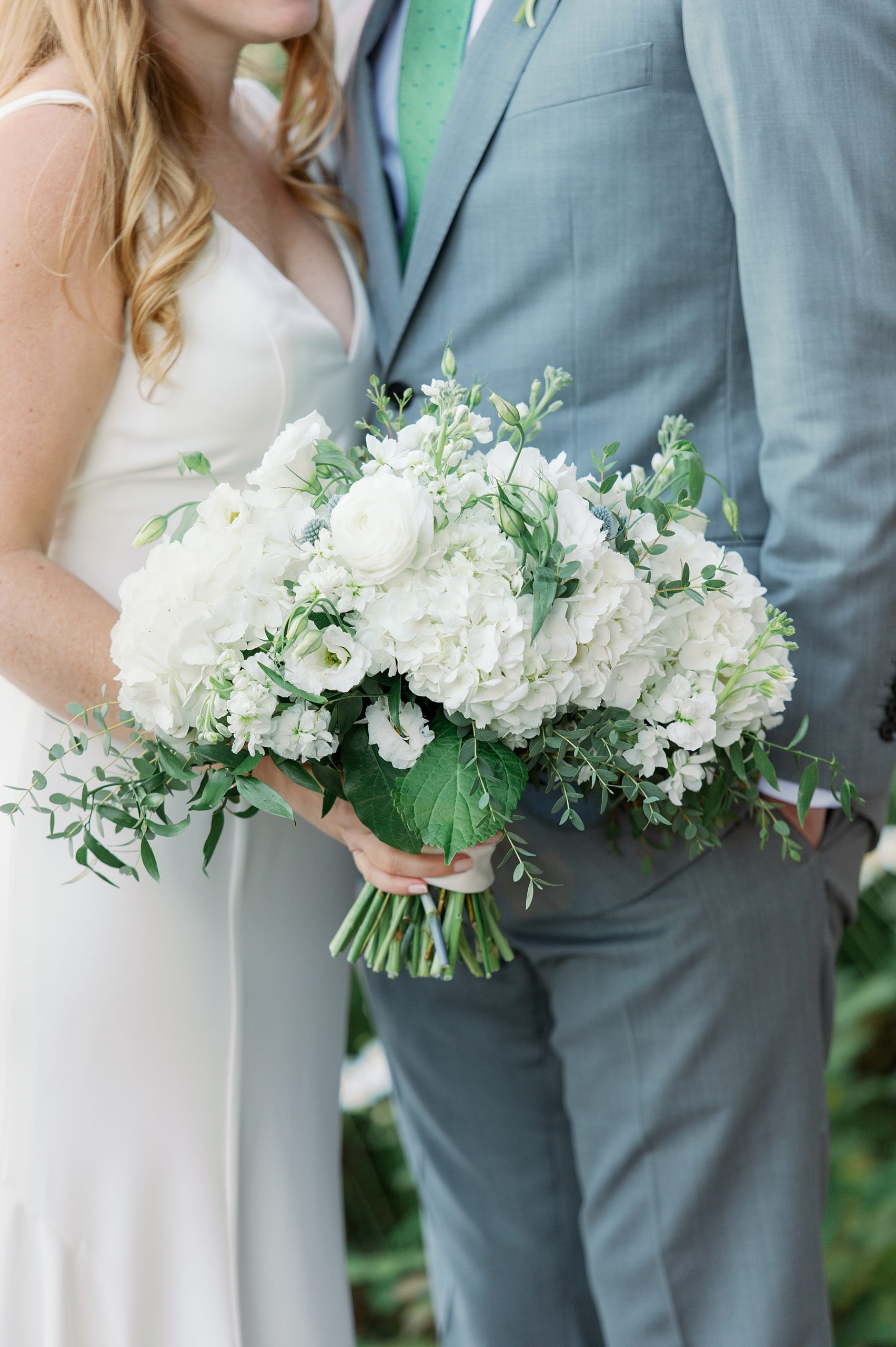 bridal bouquet in whites and greenery
