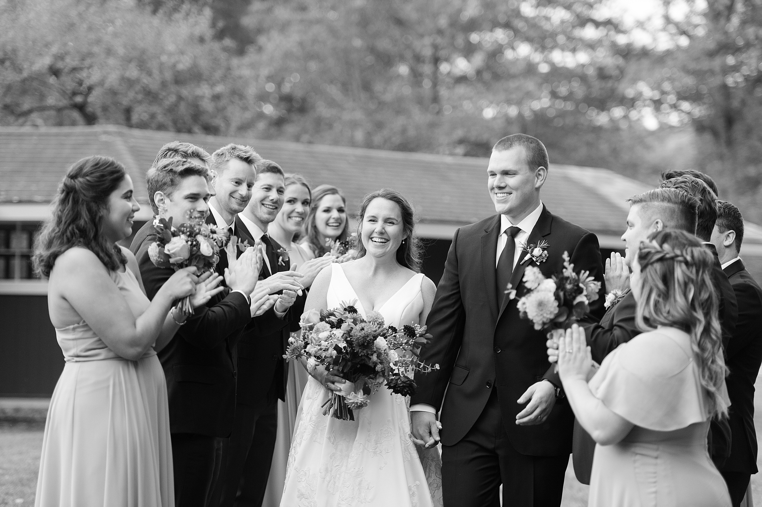 newlyweds with wedding party for portraits at coastal Maine wedding in black and white