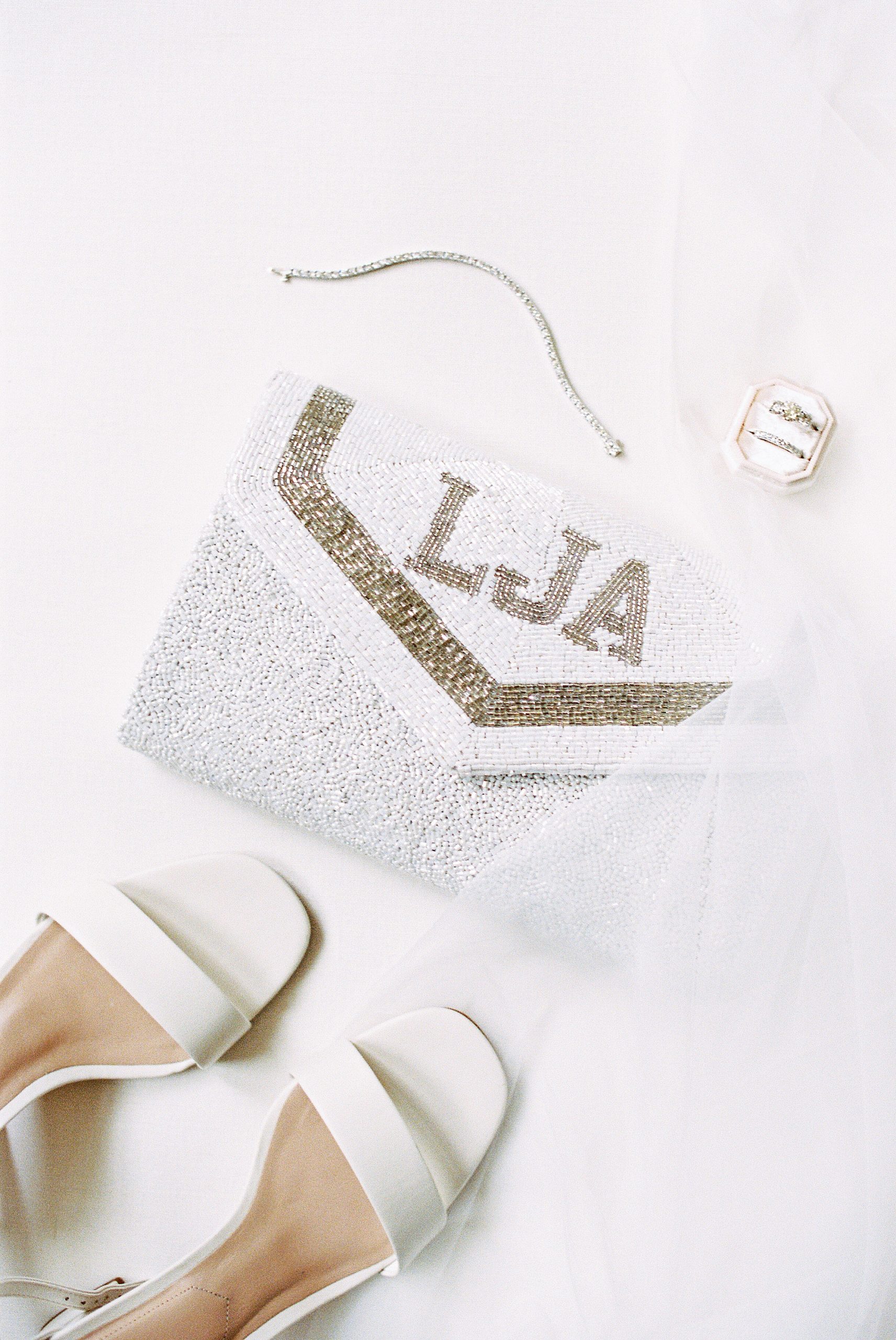 beaded monogrammed bride clutch purse and shoes film photograph