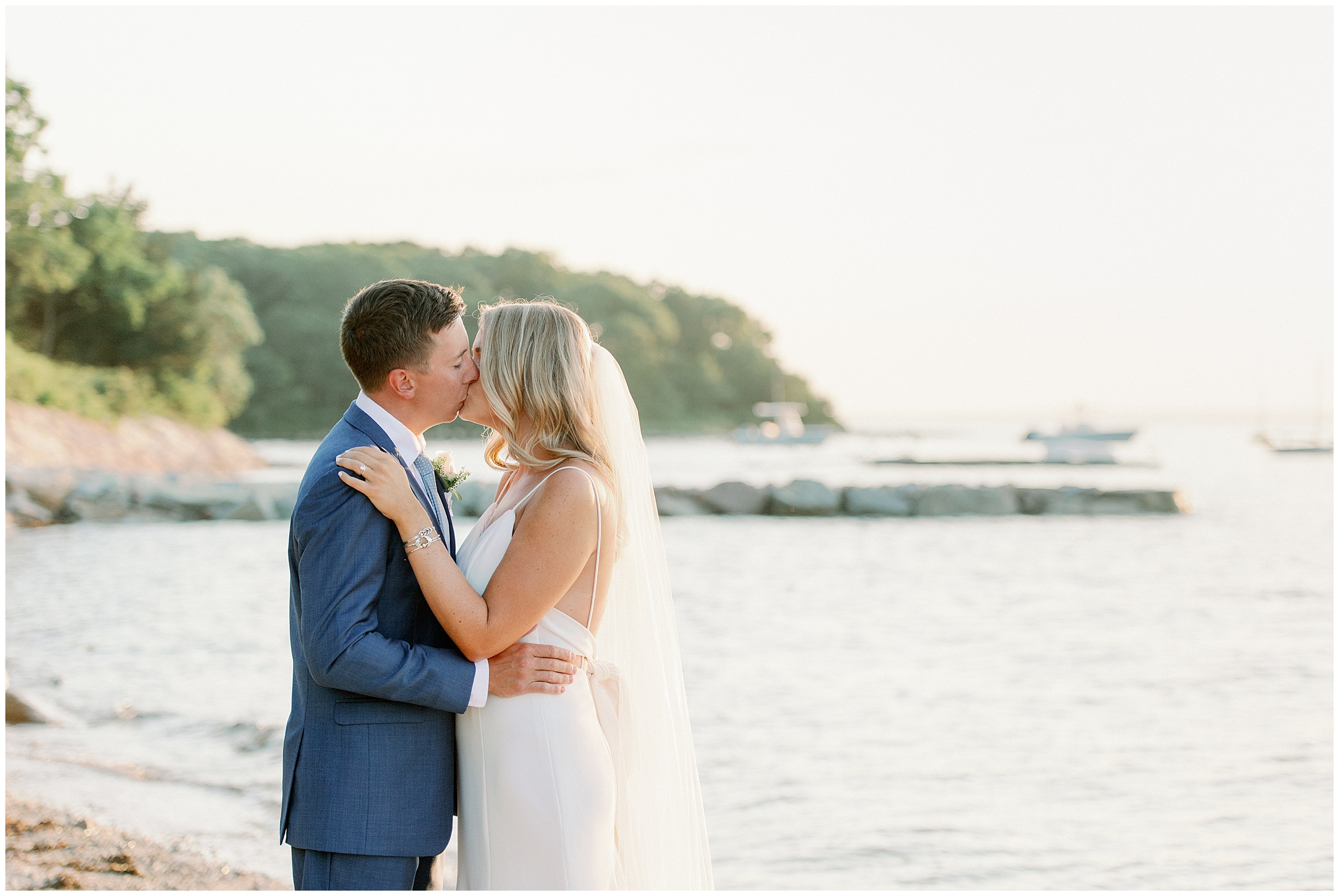 couples wedding portraits on the water on cape cod