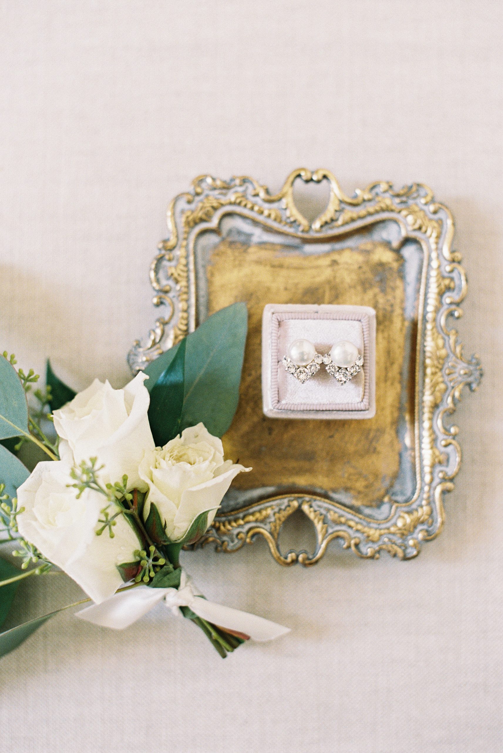 pearl earrings styled in mrs box bridal details for madison beach hotel micro wedding