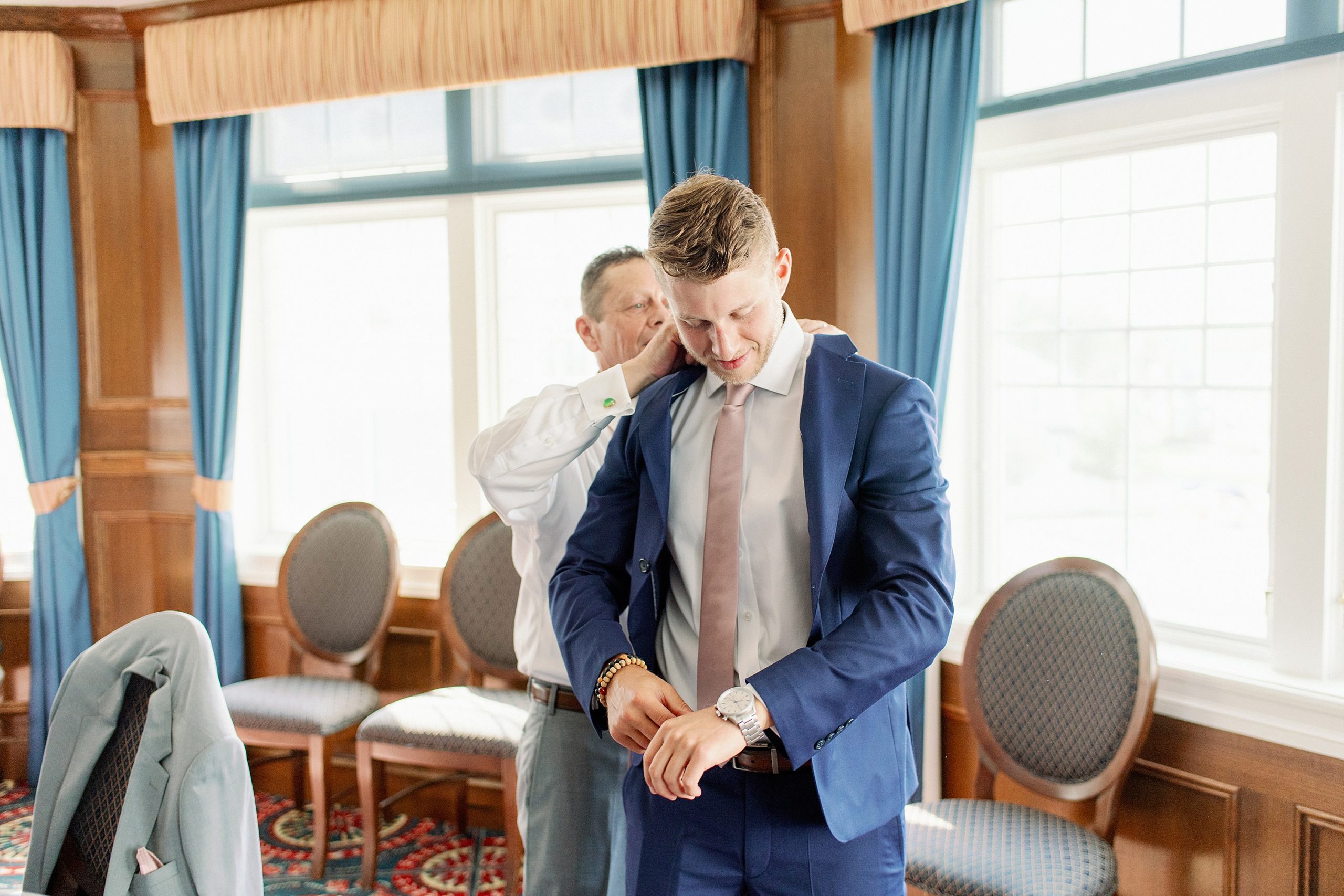 groom getting ready for micro wedding at madison beach hotel