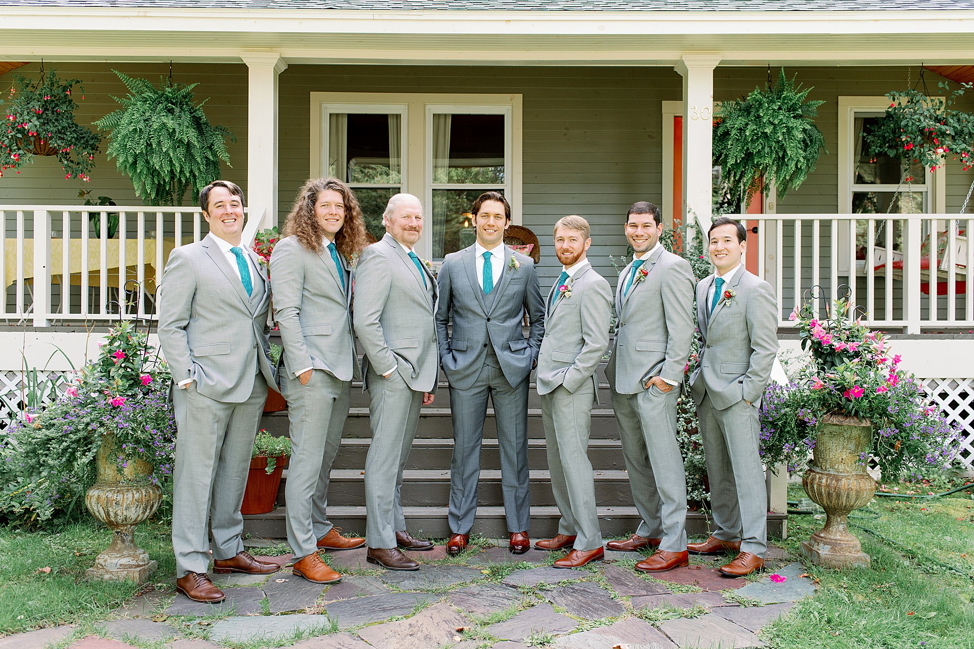 groom and groomsmen pose before Lake Placid wedding ceremony