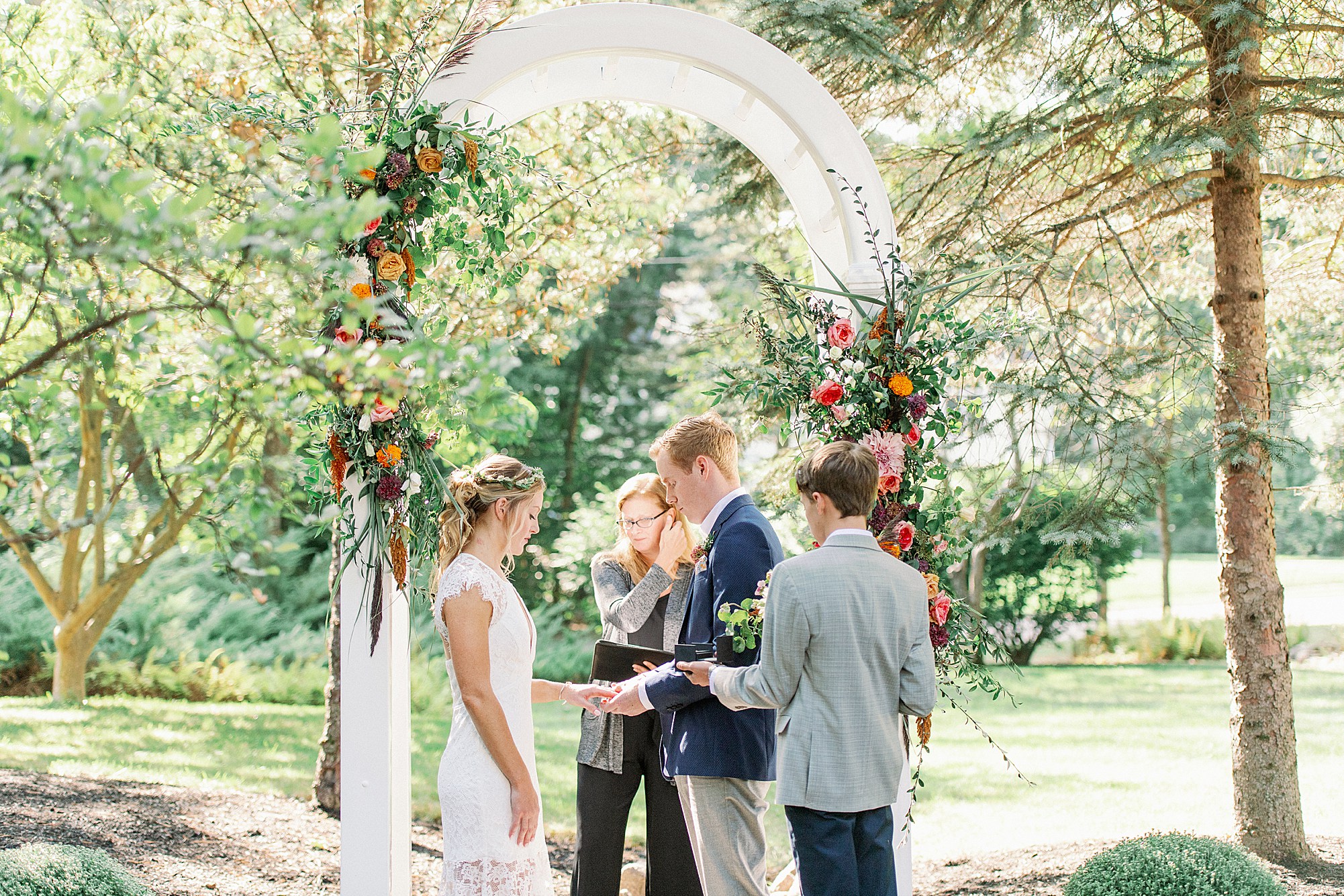 backyard micro wedding ceremony with vibrant flowers in Massachusetts