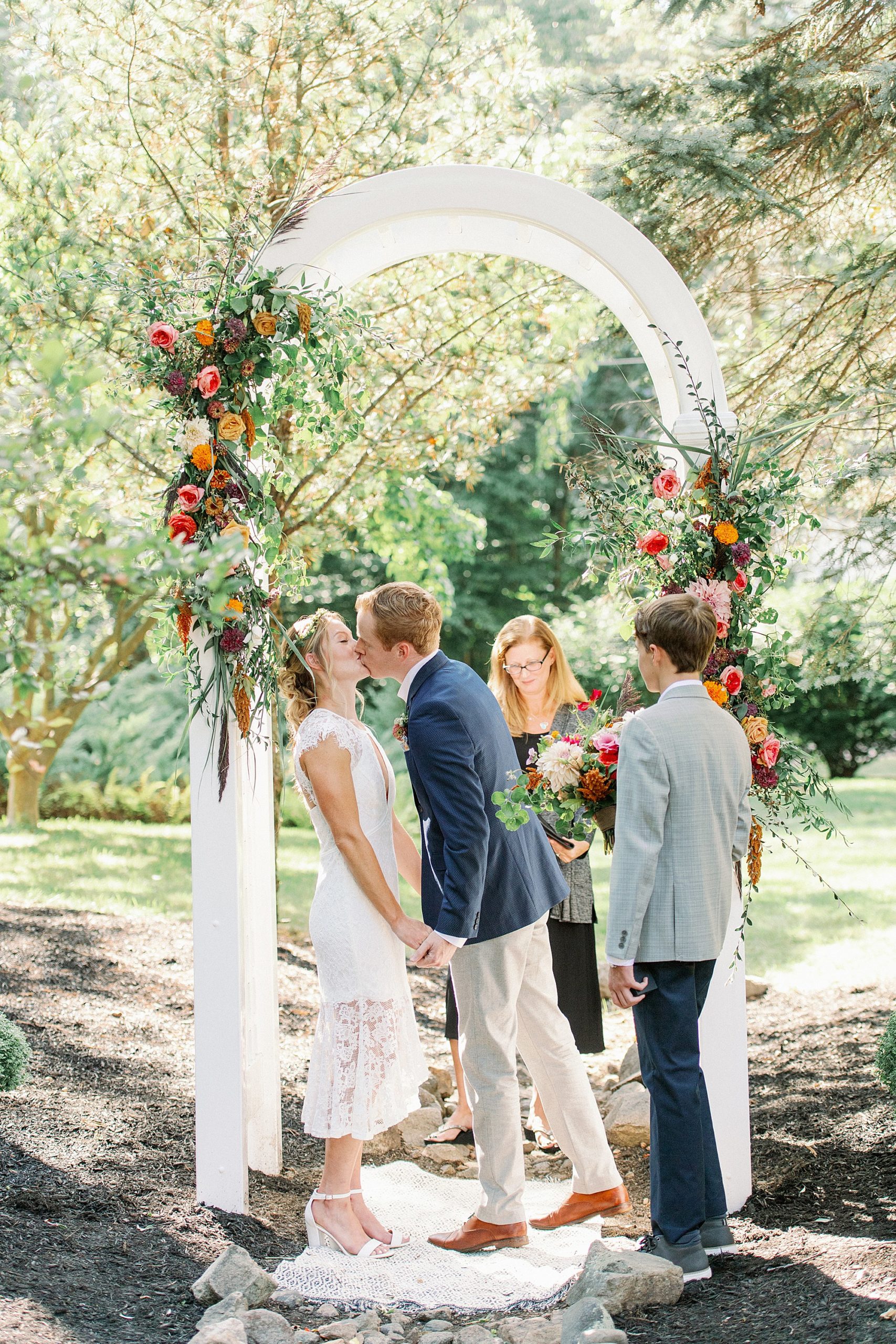 first kiss during Massachusetts backyard micro wedding