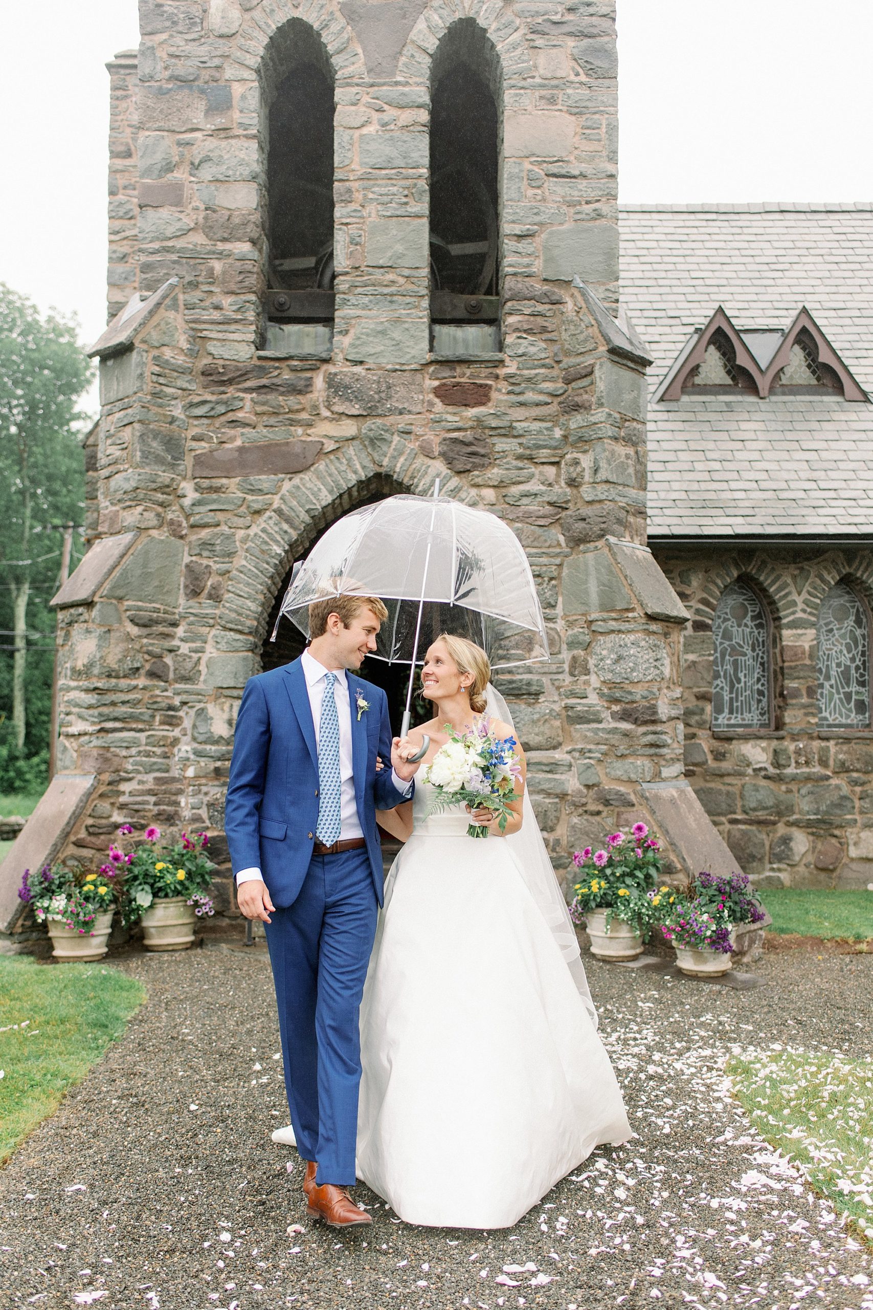 Catskills wedding ceremony couples portraits in the rain