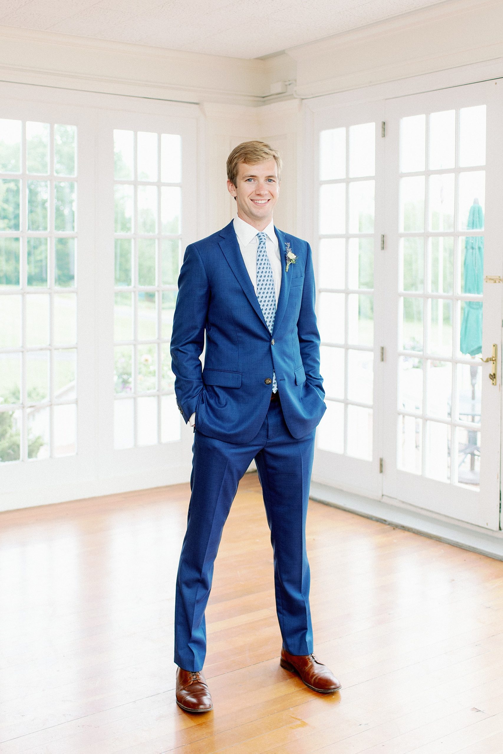 groom portrait in blue summer suit at Catskills Wedding