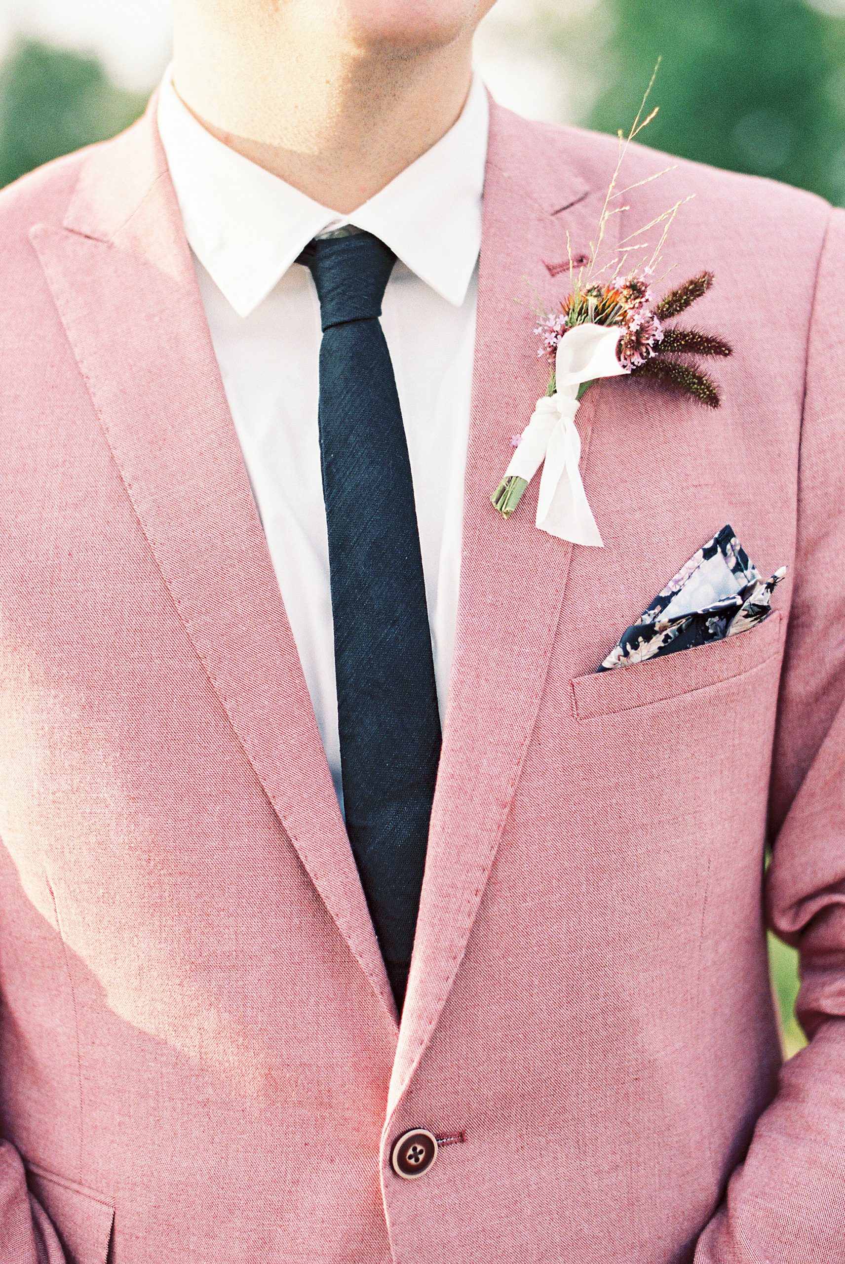 groom in salmon colored summer suit for Lake Placid Wedding