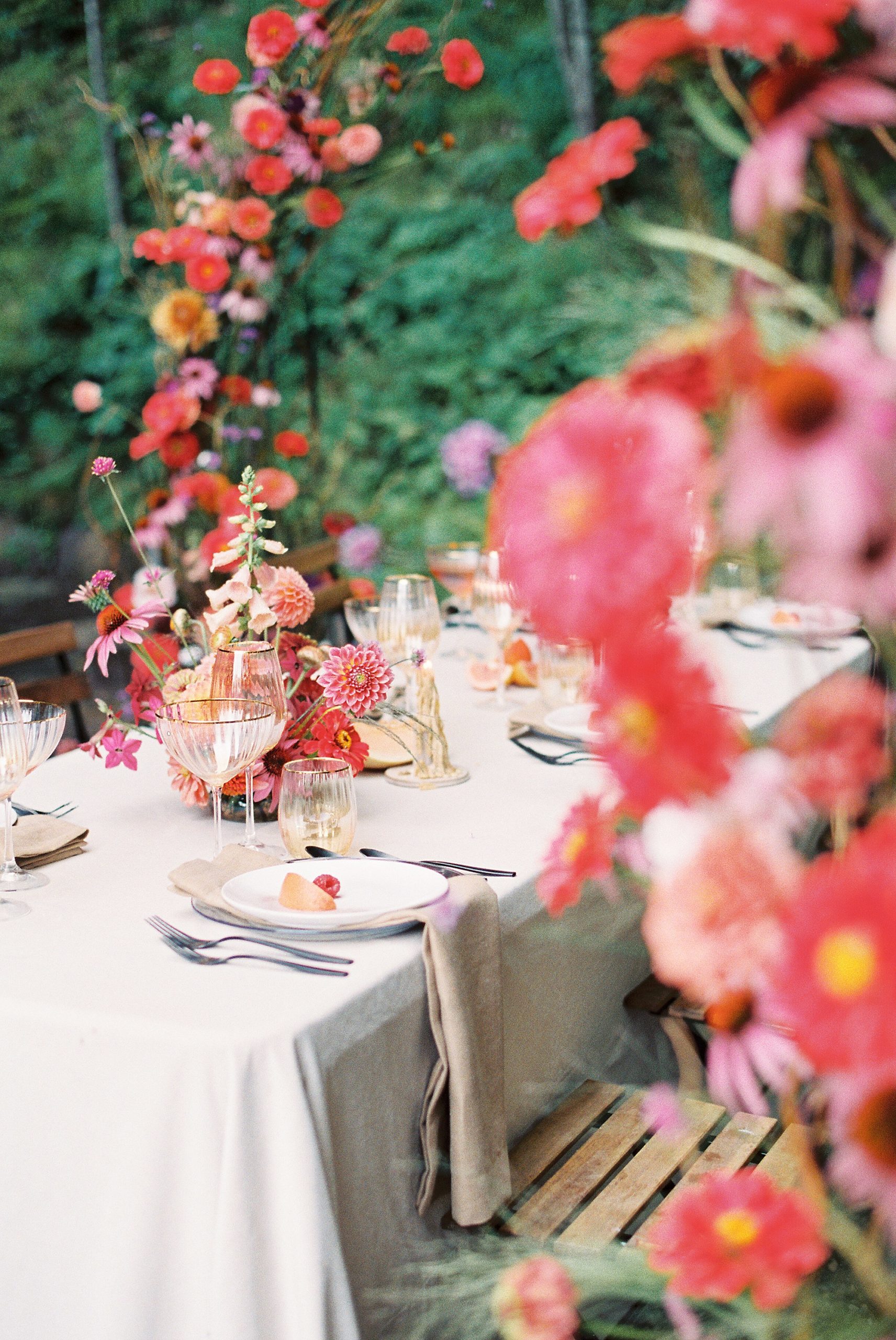 festive bright table set for intimate wedding celebration