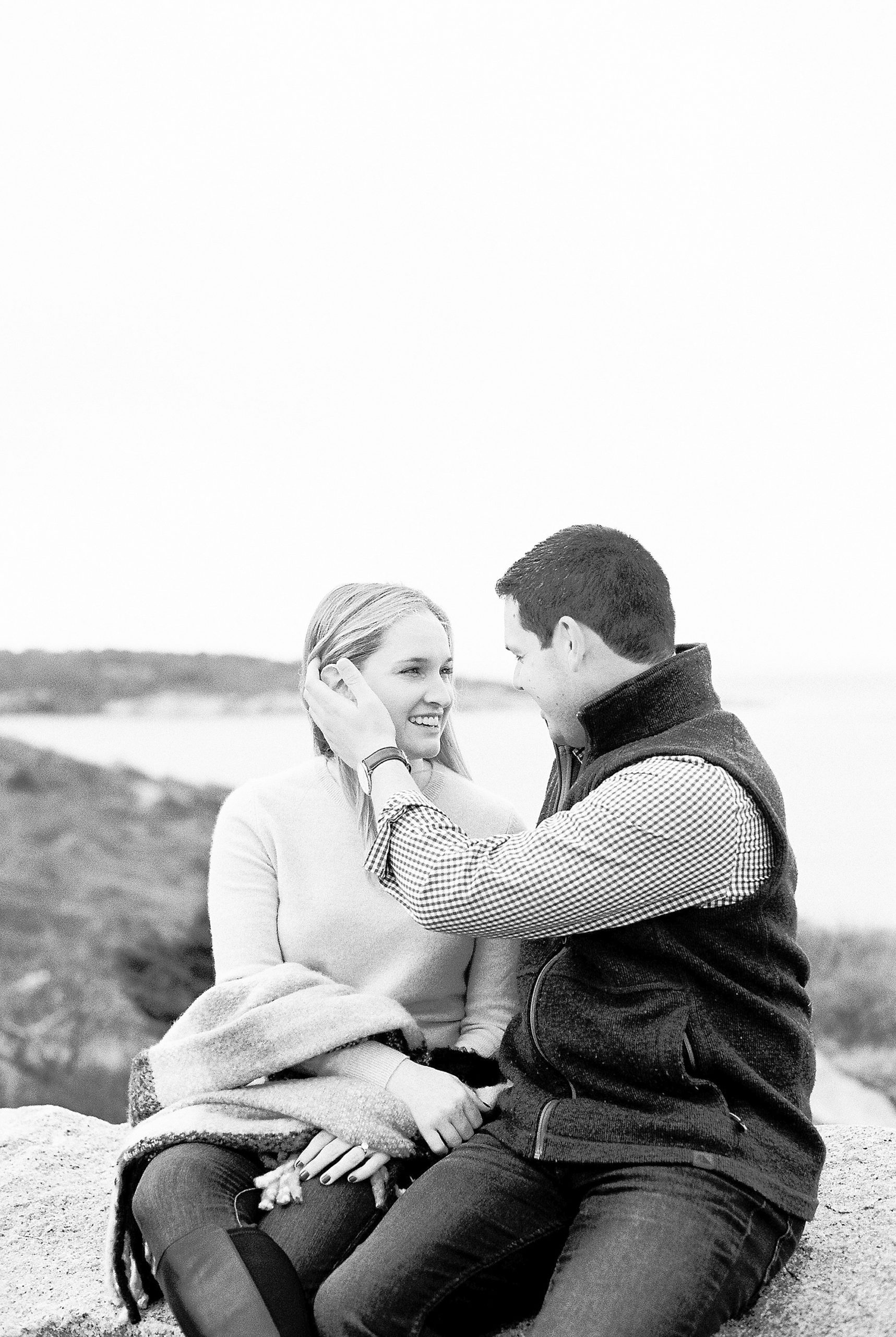 black and white engagement photo by the ocean in Rockport