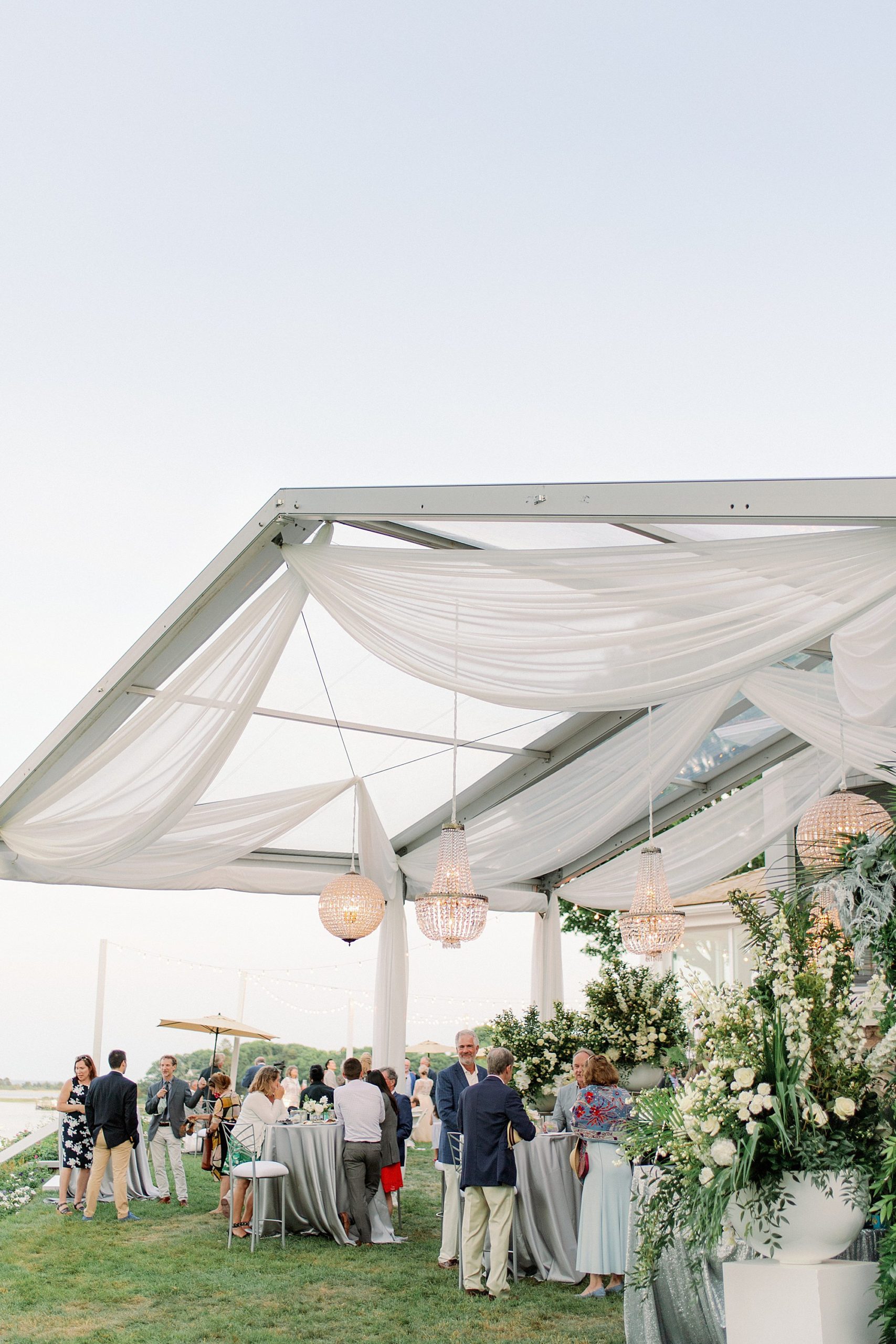 clear tent and chandeliers