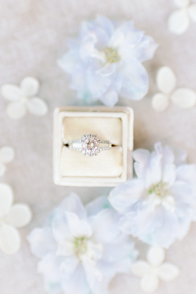 engagement ring styled flat lay with wedding flowers