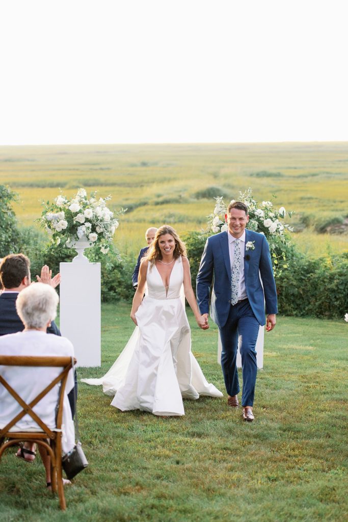 newlyweds process down the aisle at cape cod wedding