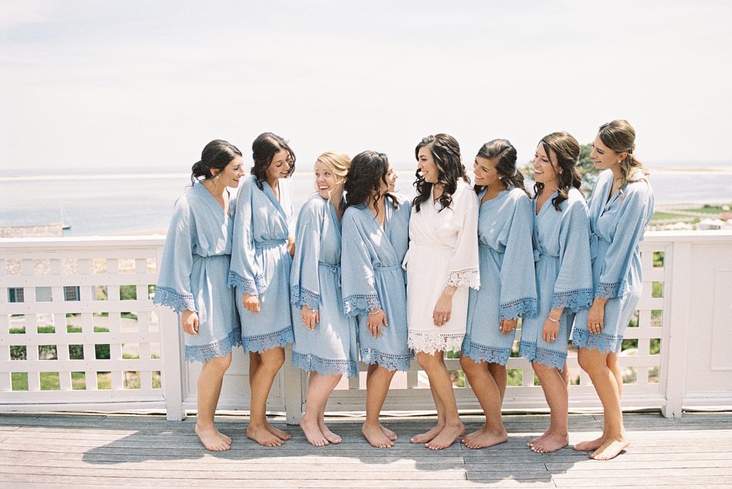 bride toasting in robes with bridesmaids at Chatham Bars Inn on Cape Cod