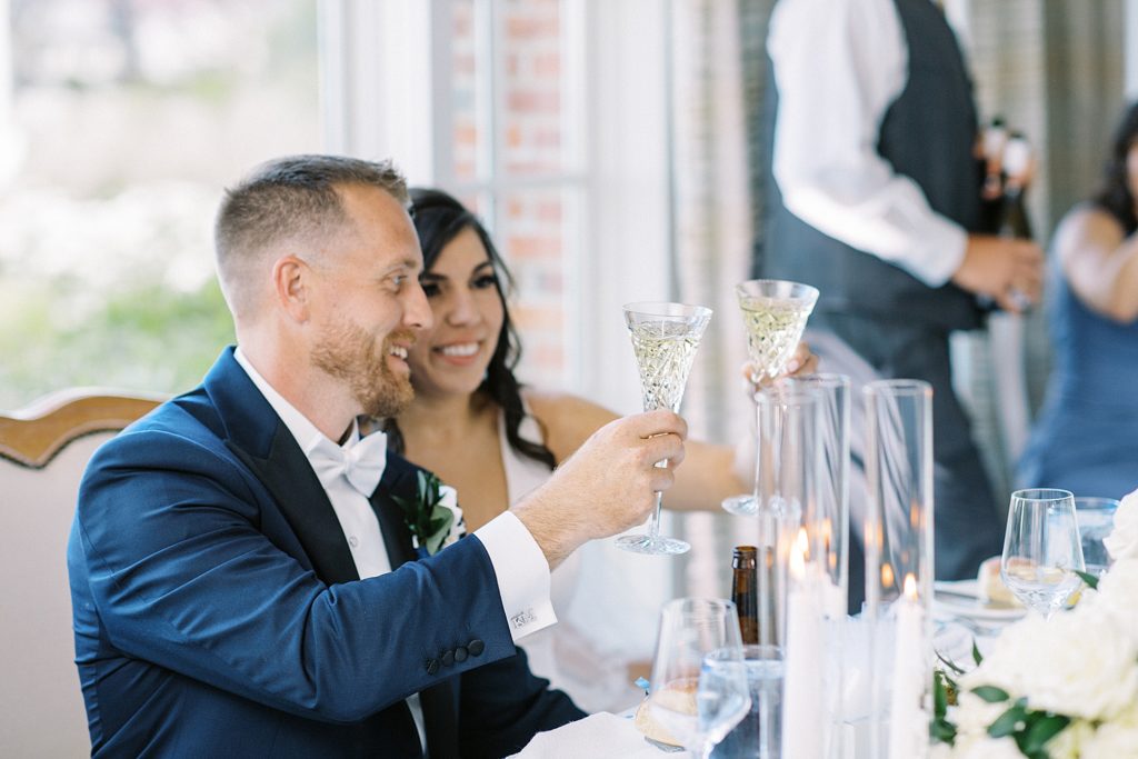 toasts to the couple at Cape Cod wedding in Chatham
