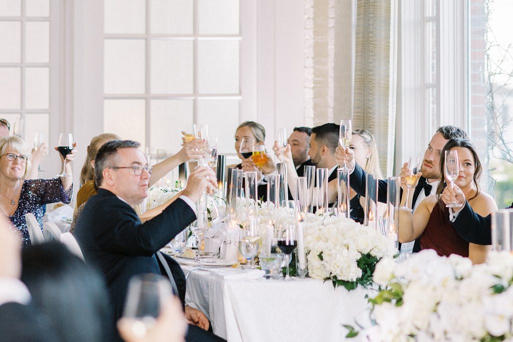 toasts to the couple at Cape Cod wedding in Chatham
