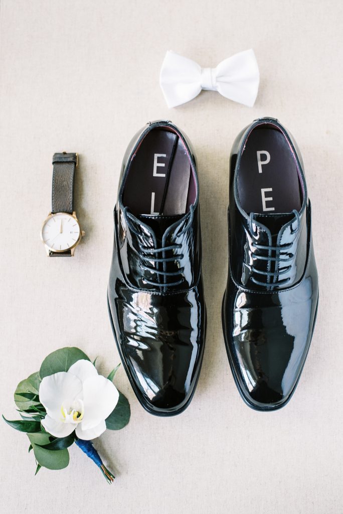 grooms details styled flat lay