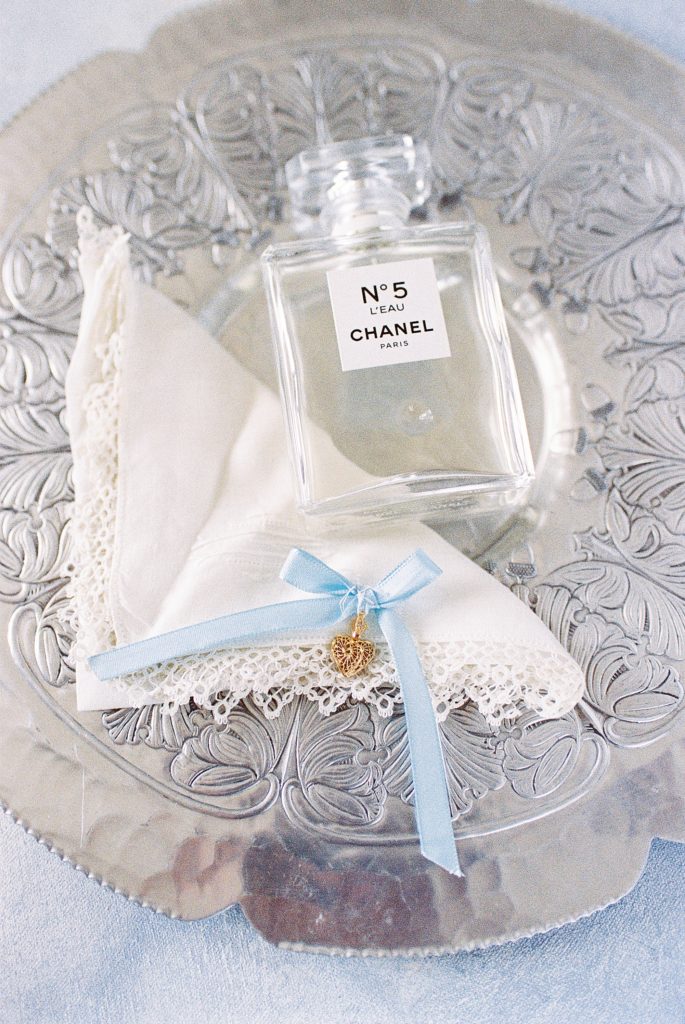 bridal details including handkerchief and charm from grandmother 