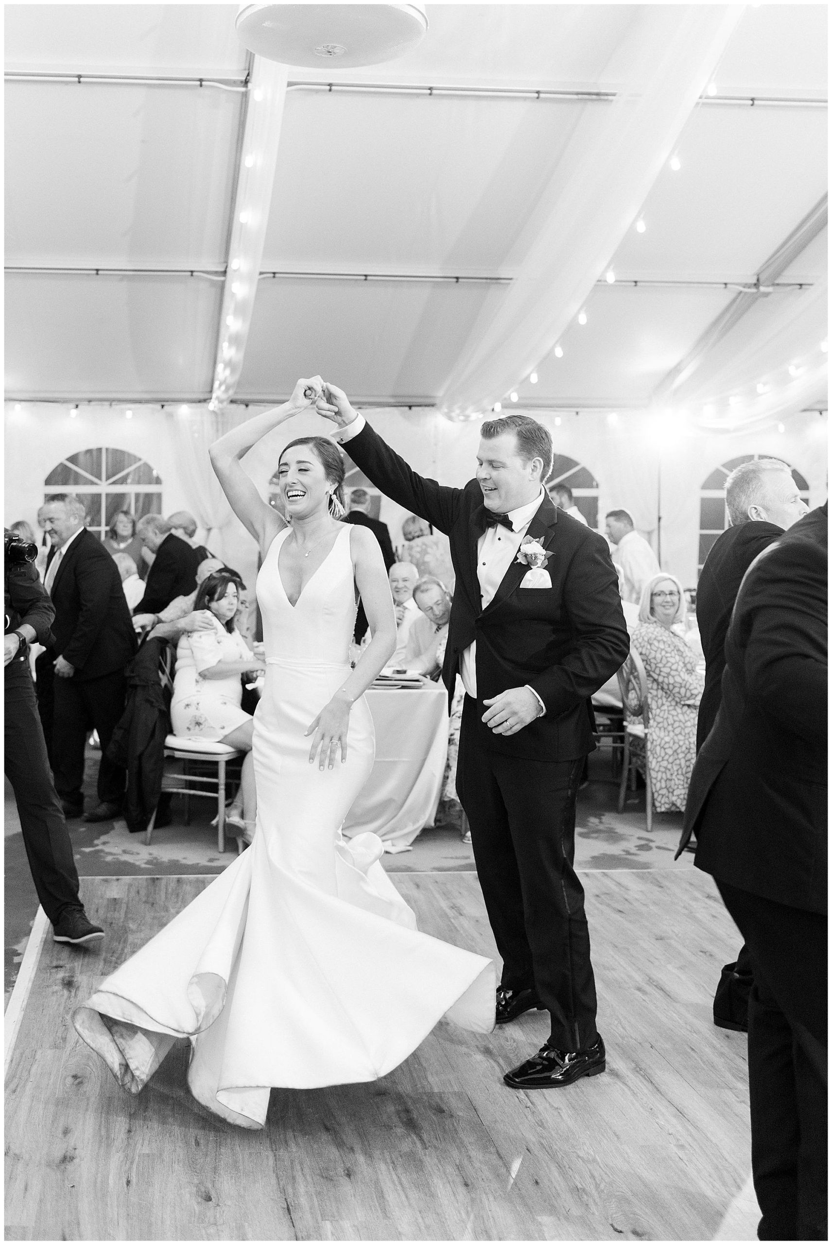 black and white of bride and groom dancing at classic boston wedding