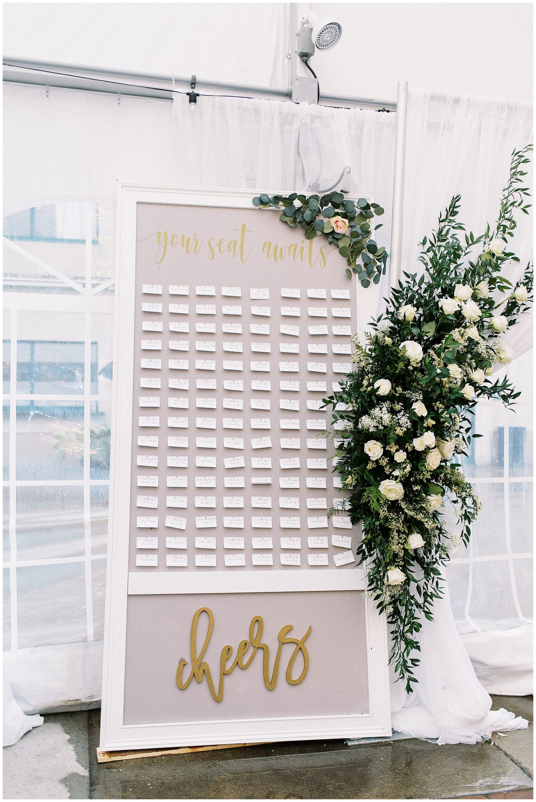 gold and gray seating chart with florals