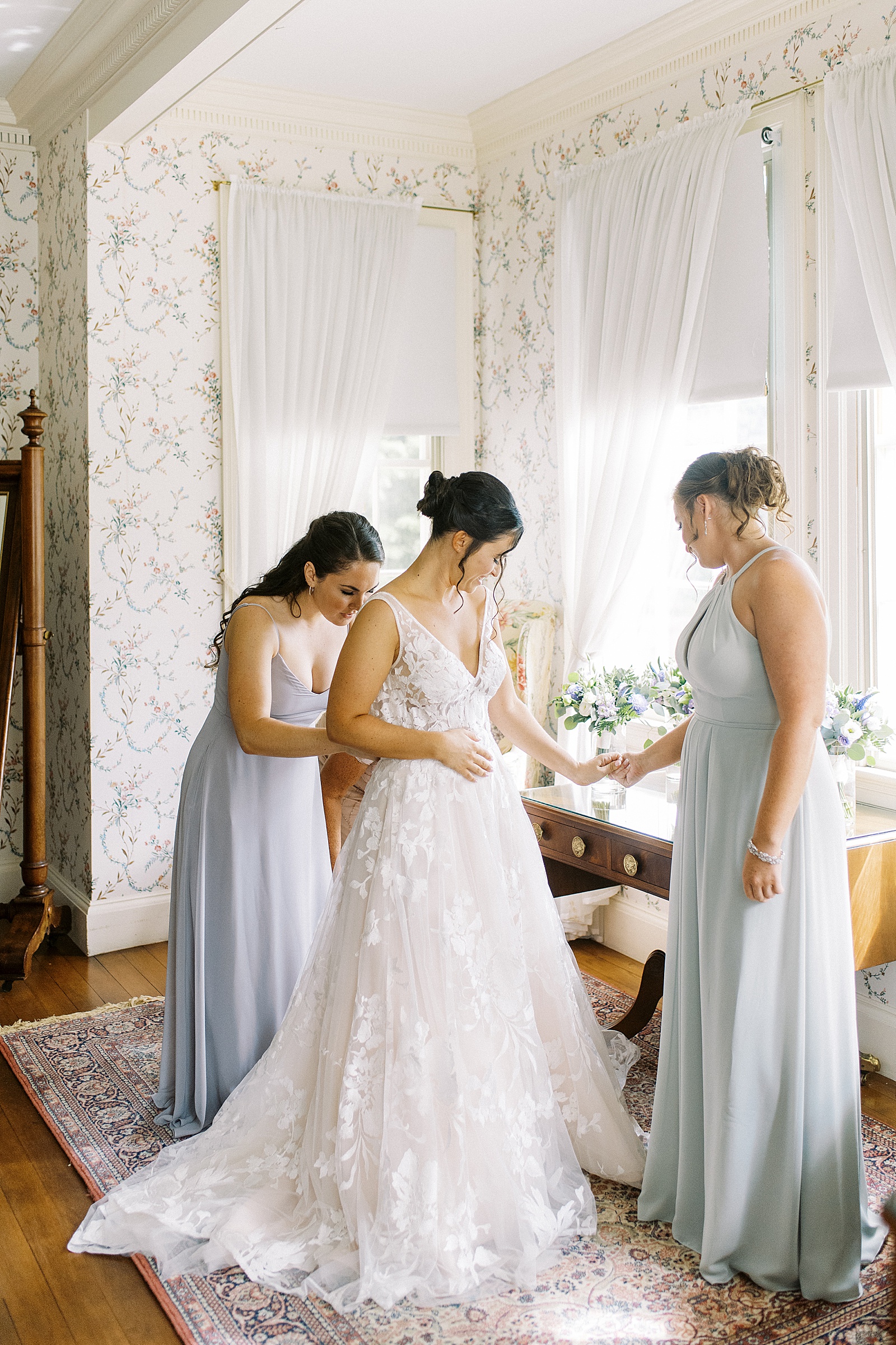 Bride getting ready with her bridesmaids at The Lyman Estate.