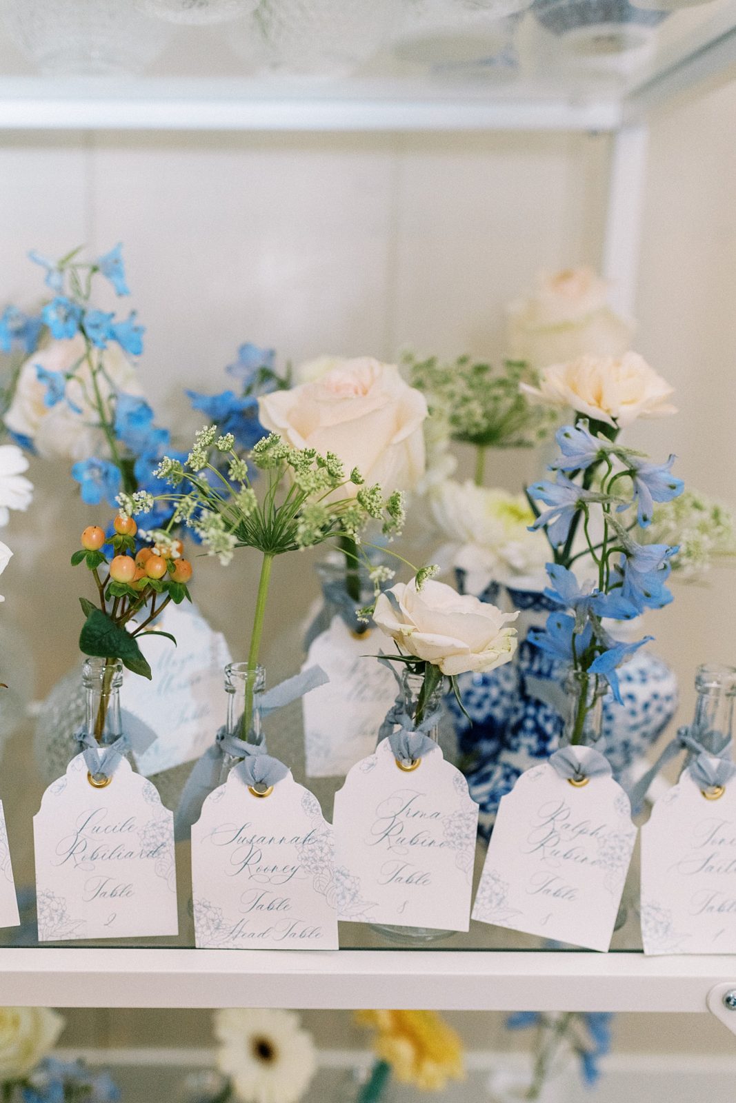 Blue and white wedding flowers with tags for a wedding with a Cape Cod wedding photographer.