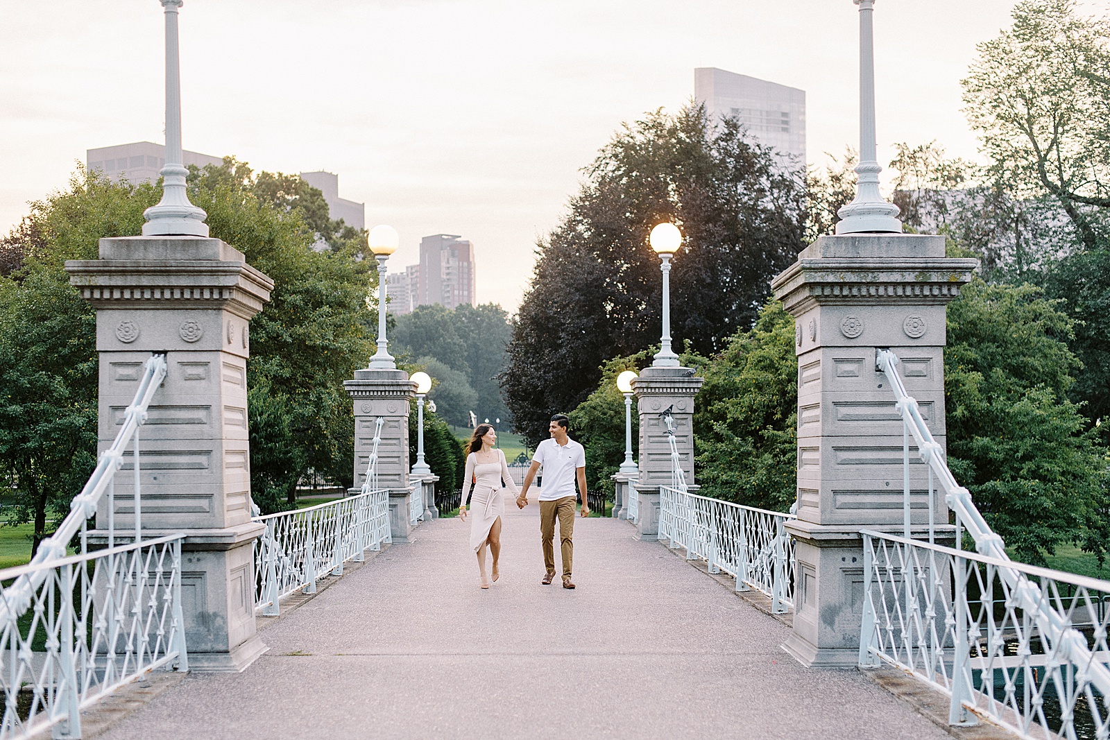 Couple walking along a bridge by New York Wedding Photographer, Lynne Reznick.