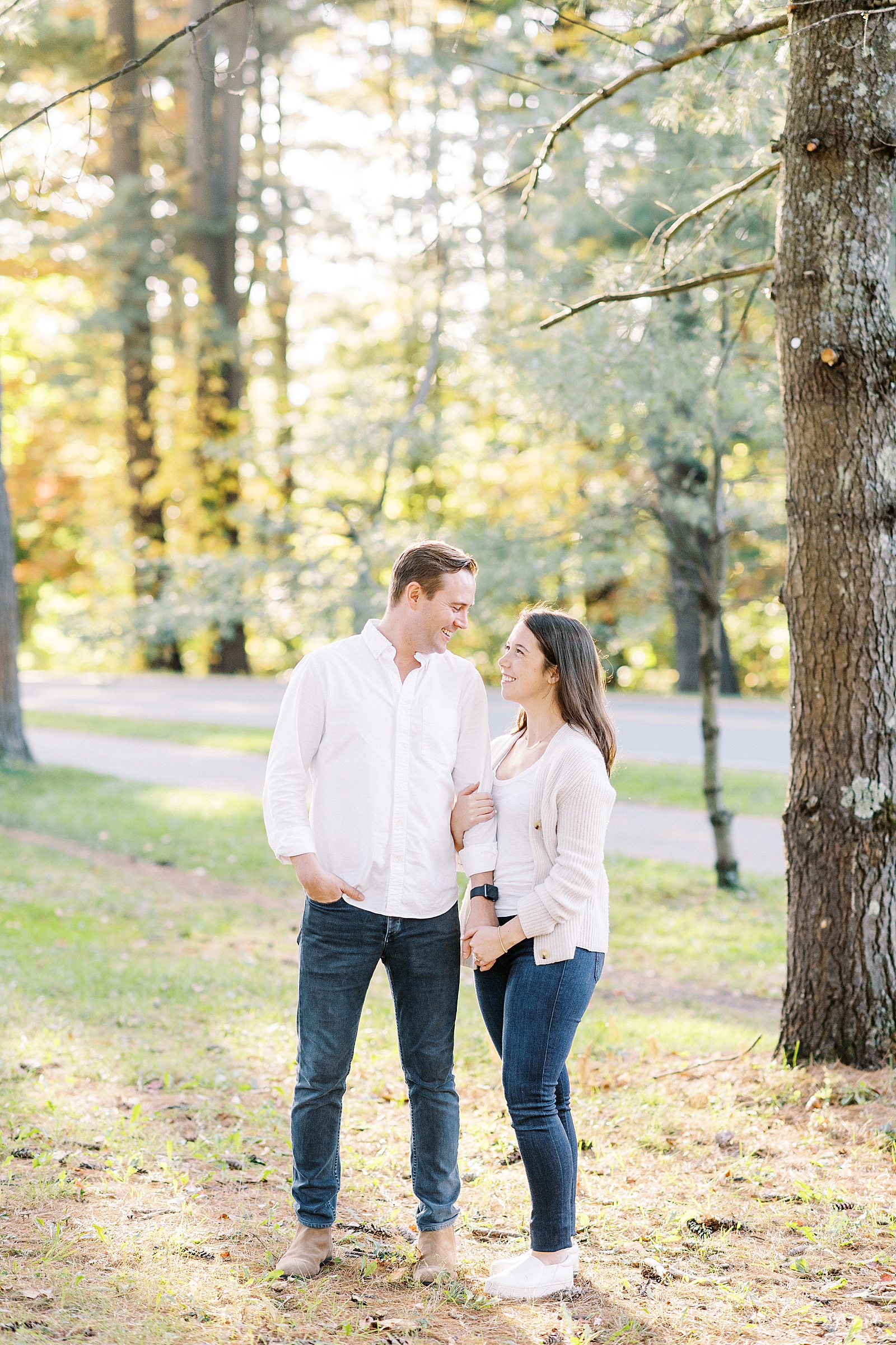 Couple embracing in a park for their Saratoga Springs Engagement